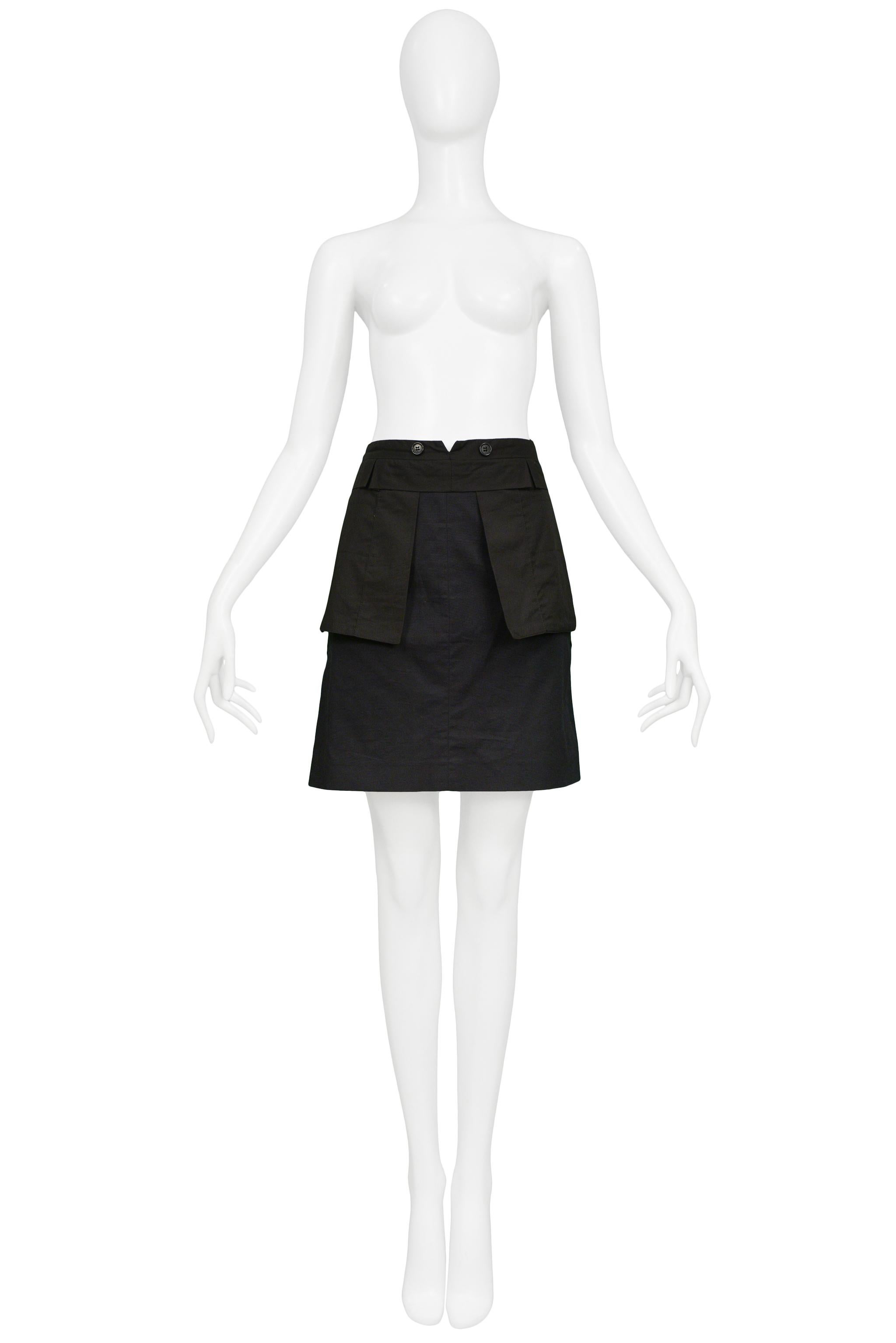 Resurrection Vintage is excited to offer a vintage Helmut Lang black cotton inside-out skirt featuring exposed front pocket flaps, a flap waistband with buttons, cargo pockets, and an asymmetrical hem. 

Helmut Lang 
Size 42
Measurements: Waist 32
