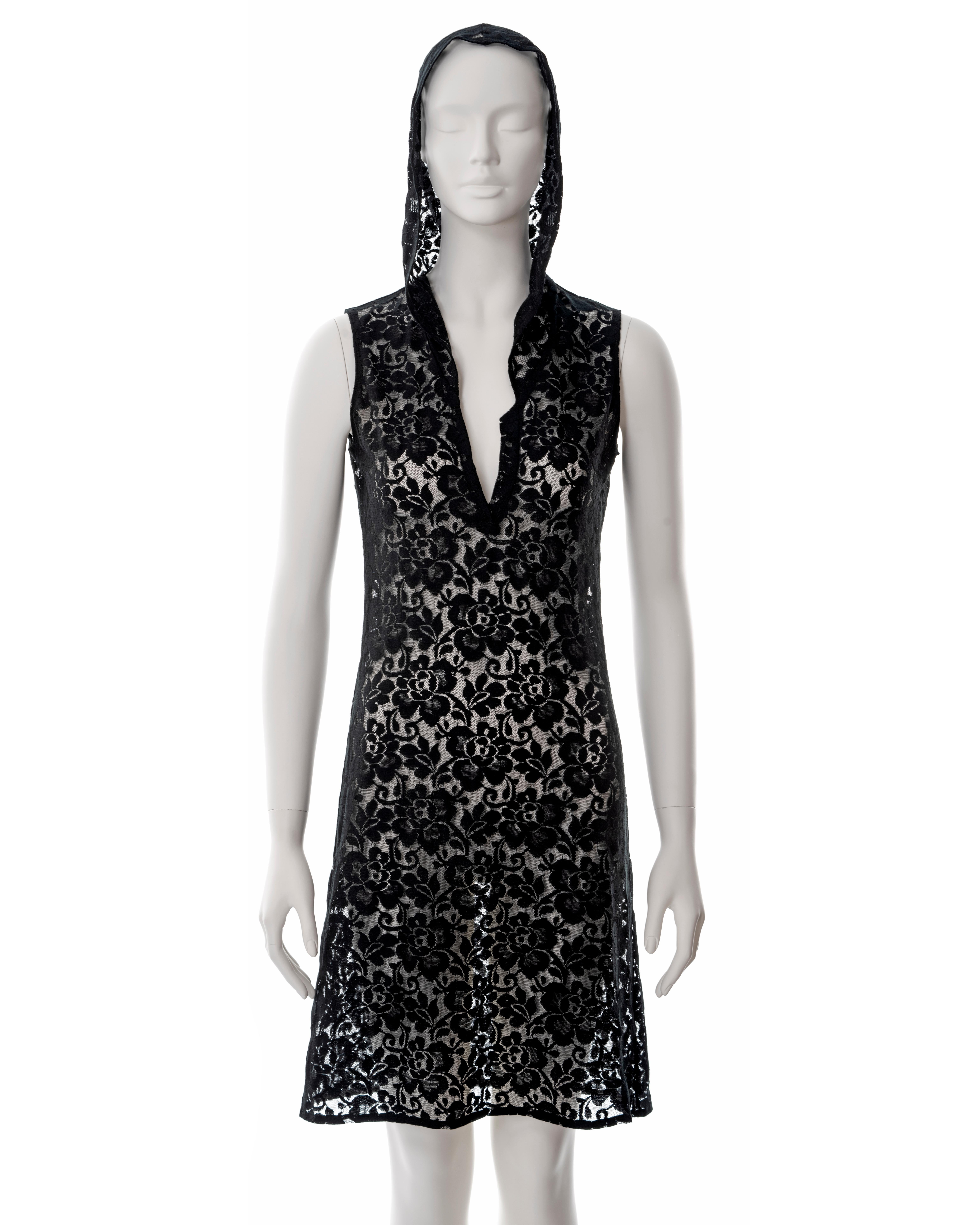 ▪ Helmut Lang black lace hooded shift dress
▪ Sold by One of a Kind Archive
▪ Spring-Summer 1996
▪ V-neck
▪ Knee length
▪ Approx. size Small
▪ Made in Italy  

All photographs in this listing EXCLUDING any reference or runway imagery needs the