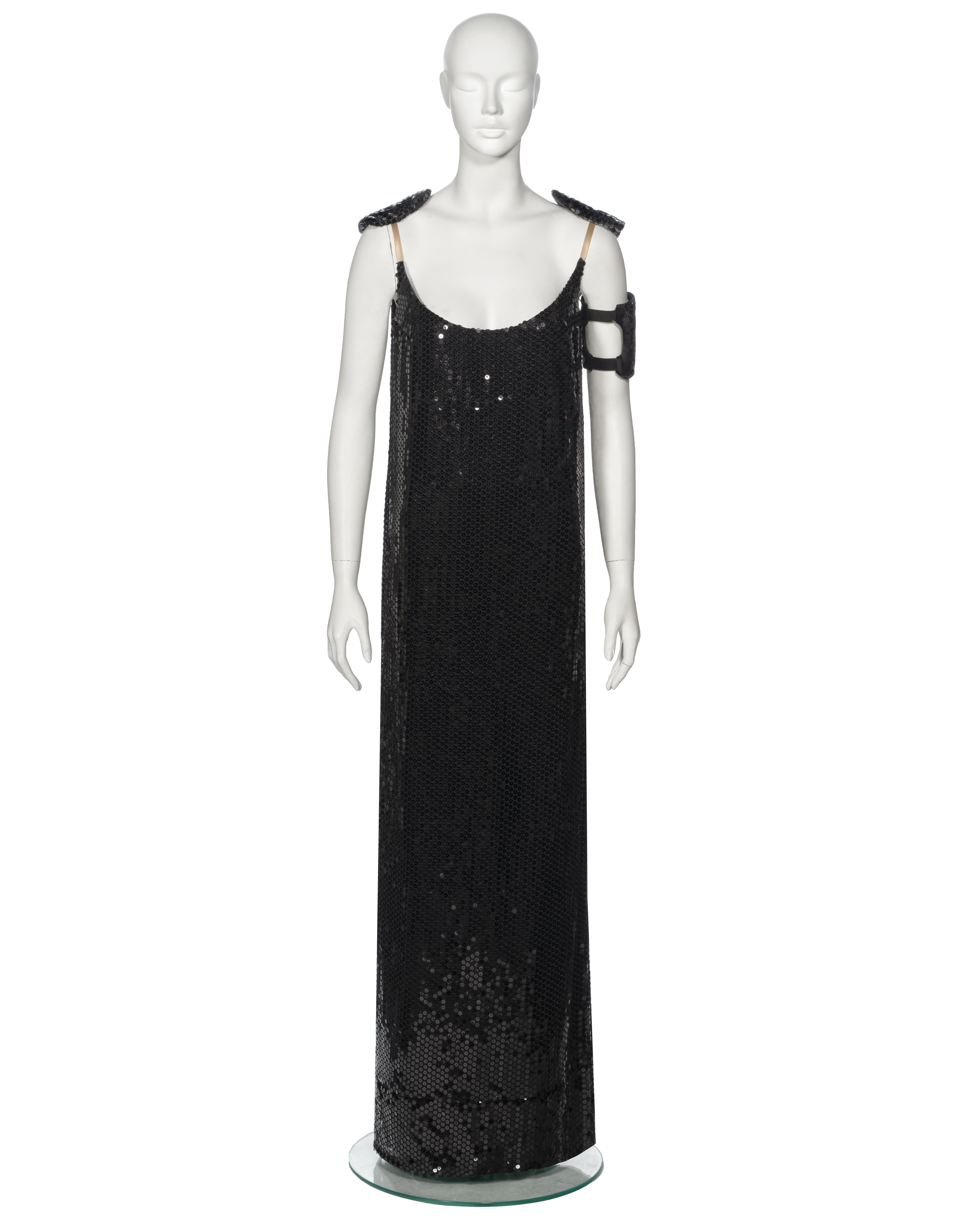 ▪ Archival Helmut Lang Evening Dress 
▪ Fall-Winter 1999
▪ Sold by One of a Kind Archive
▪ Museum Grade 
▪ Crafted from black sequin fabric 
▪ Features a straight cut, full-length design that falls to the floor
▪ Designed with a deep scoop