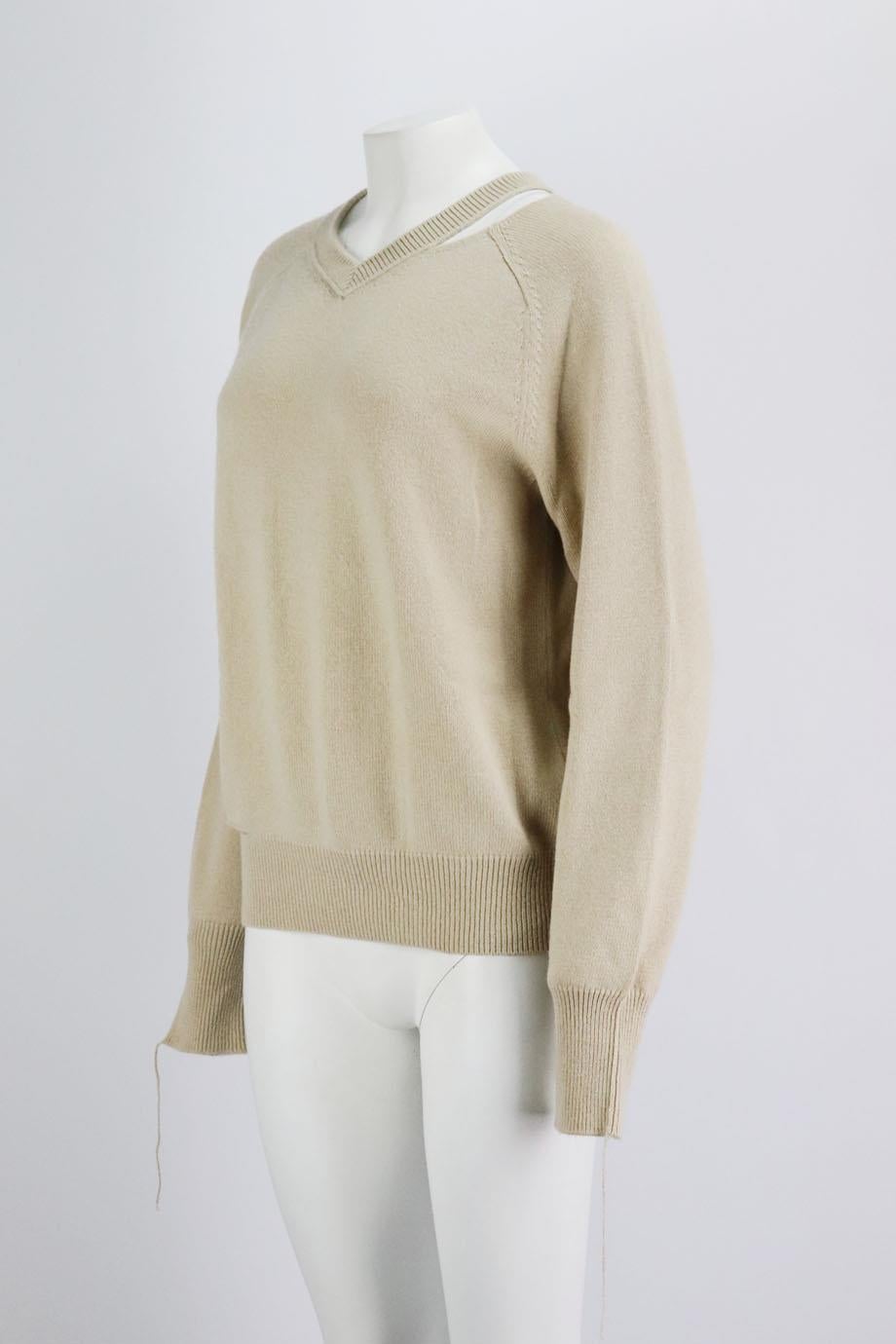 This sweater by Helmut Lang has been knitted from beige wool and cashmere-blend with artful pilling and distressed ladders throughout. Beige wool and cashmere-blend. Slips on. 50% Cotton, 35% wool, 15% cashmere. Size: Small (UK 8, US 4, FR 36, IT