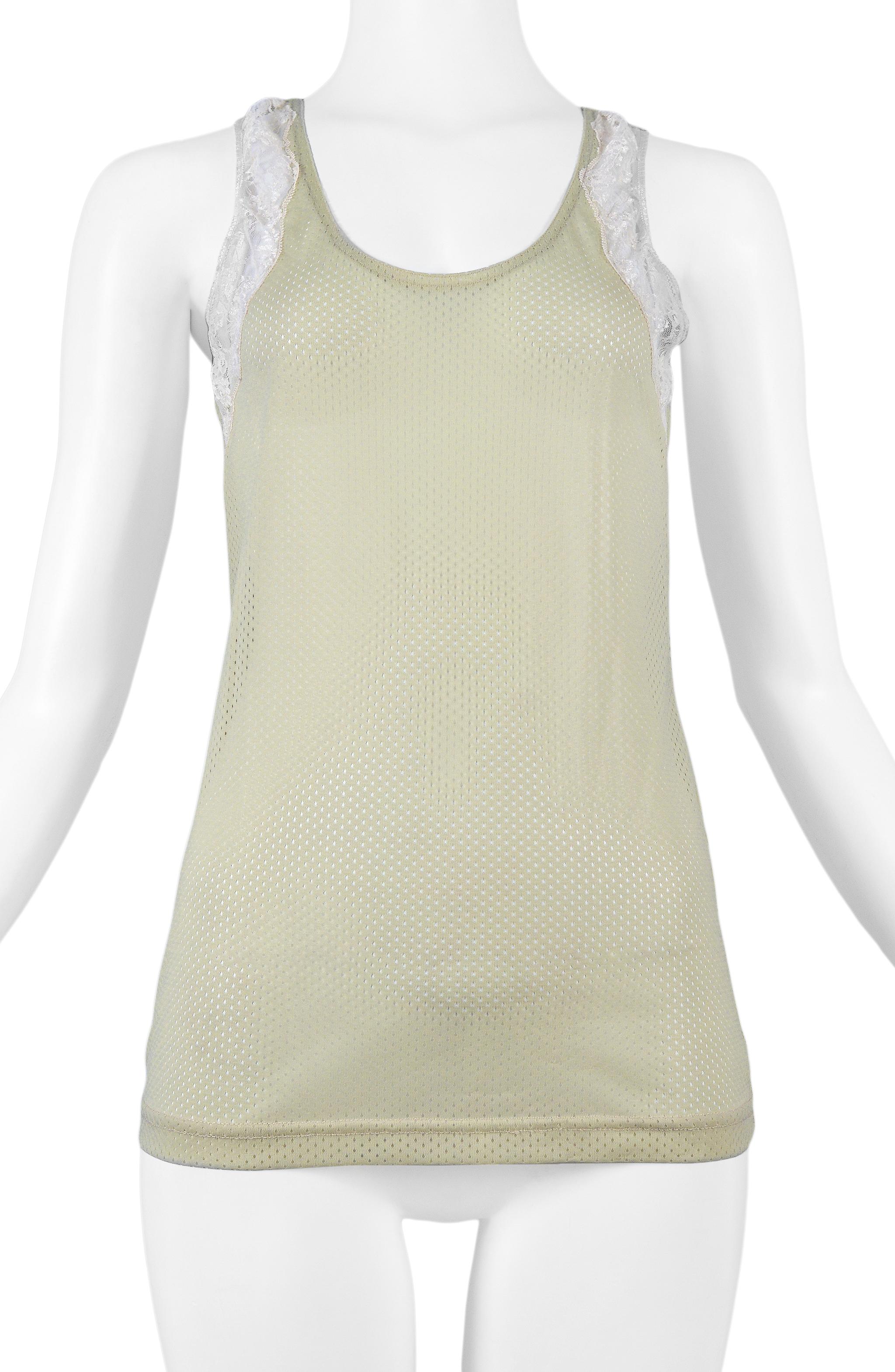 Resurrection Vintage is excited to offer a vintage Helmut Lang khaki tank top featuring sports mesh fabric, a scoop neckline, straps with lace trim, and hip length body. 

Helmut Lang 
Size Small
Mesh Lace 
Excellent Vintage Condition 
Authenticity