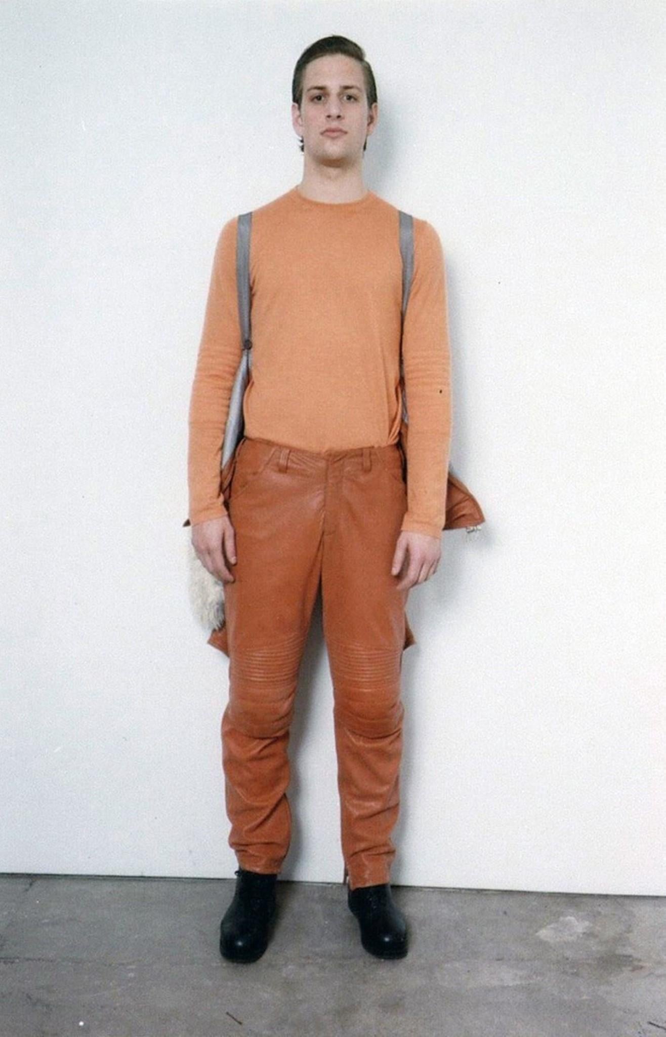 Archive HELMUT LANG Fall Winter 1999 space pants come in distressed orange leather with zip ankles, quilted knee pad details, and bondage strap waistband.Made in Italy.

Excellent Pre-Owned Condition.
Marked: IT 40 M  HD

Measurements:

Waist: 30