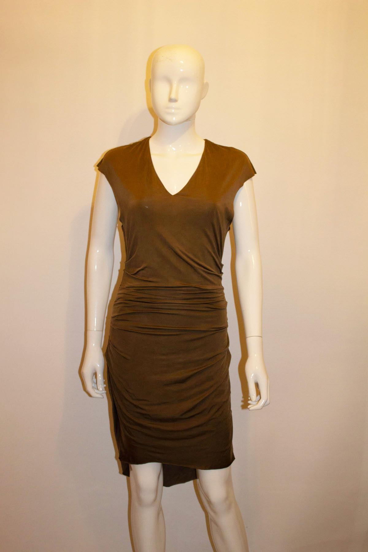 A chic and easy to wear cocktail dress by Helmut Lang. The sleaveless dress has a v neckline with gathering on both sides. The dress is lined and pops over the head. Made in the USA. Size S
Measurements Bust up to 36'', length 39'' front, 42''back.