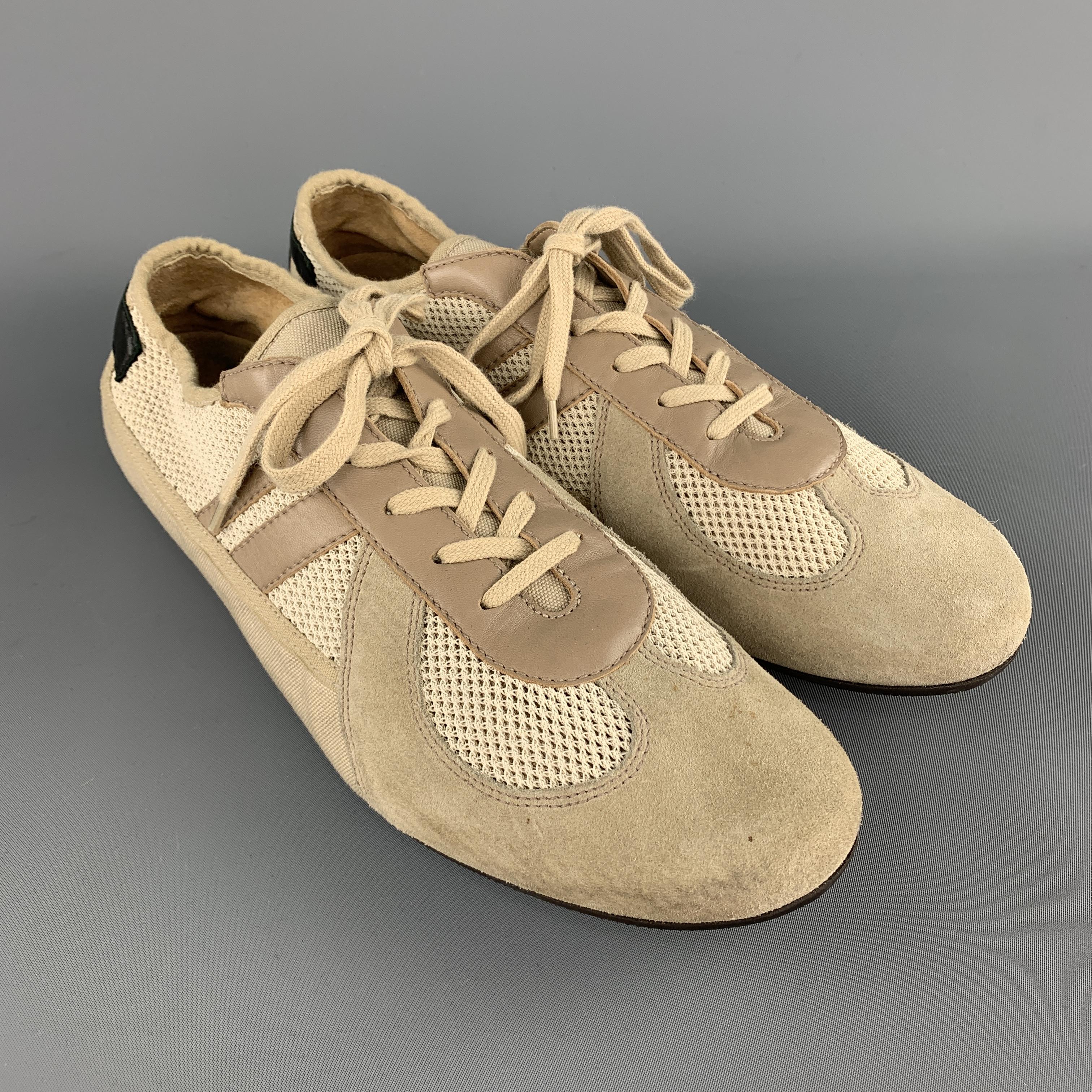 HELMUT LANG trainers come in beige suede with taupe leather stripes, light beige mesh panels, and black leather heel panel. Spots on right toe. Made in Italy.

Excellent Pre-Owned Condition.
Marked: UK 10.5

Outsole: 12.5 x 4 in.