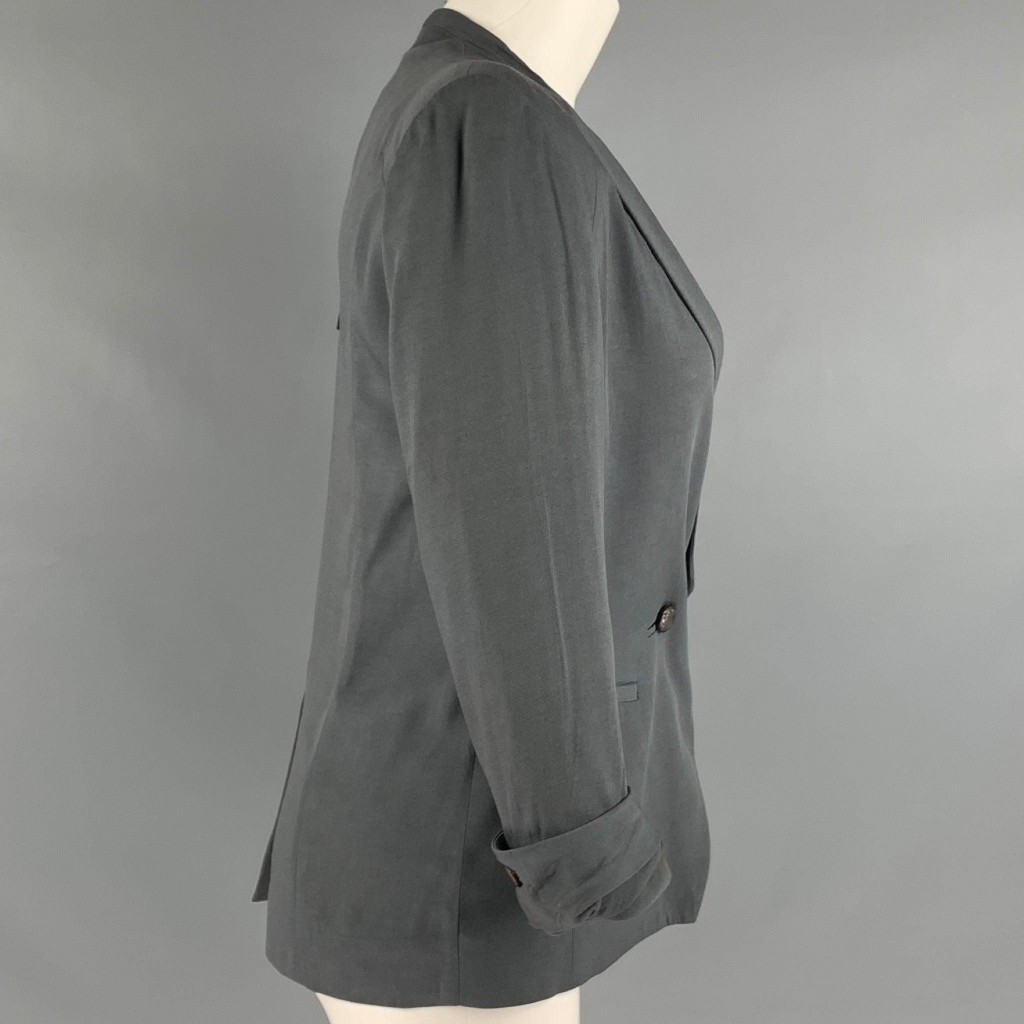 HELMUT LANG
jacket in a grey viscose blend fabric featuring a double breasted style, zip front, padded shoulders, and a two button closure. As-is. Made in USA.Good Pre-Owned Condition. Moderate signs of wear. 

Marked:   2 

Measurements: 
