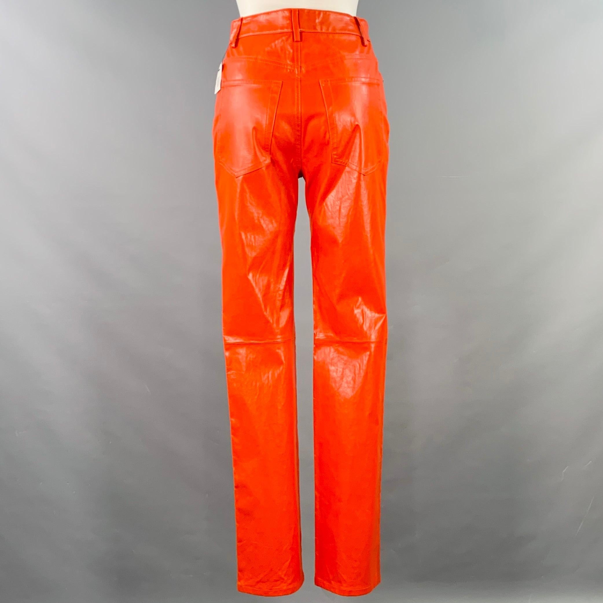 HELMUT LANG casual pants
in a magma orange lambskin leather featuring a jean cut style with five pockets, straight leg, and button fly closure.New with Tags 

Marked:   2 

Measurements: 
  Waist: 28 inches Rise: 10.5 inches Inseam: 31 inches 
  
 