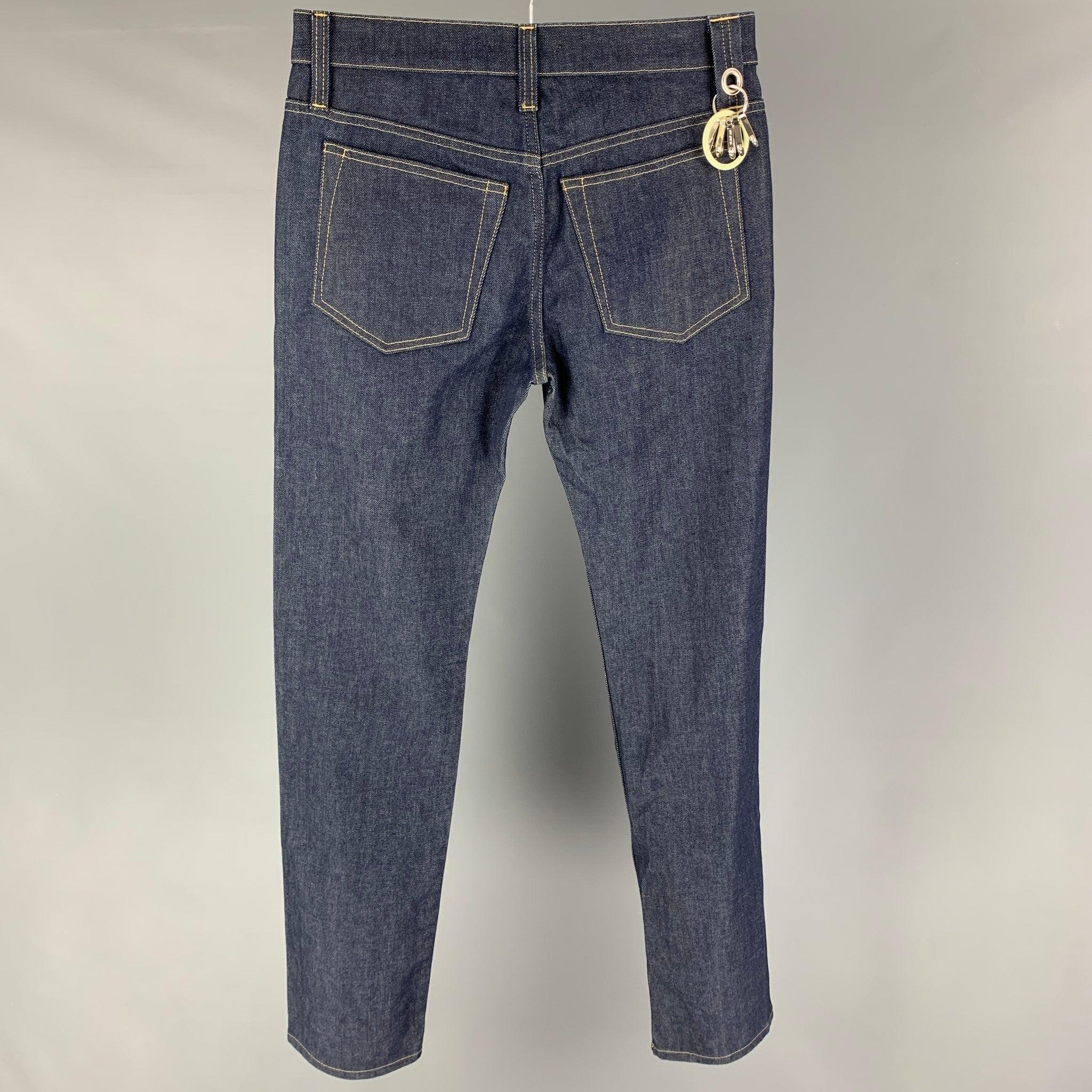 HELMUT LANG jeans comes in a blue cotton featuring a slim straight fit, contrast stitching, multi key rings, and a button fly closure. Made in Italy.
Excellent
Pre-Owned Condition. 

Marked:   30 

Measurements: 
  Waist: 30 inches Rise: 10 inches