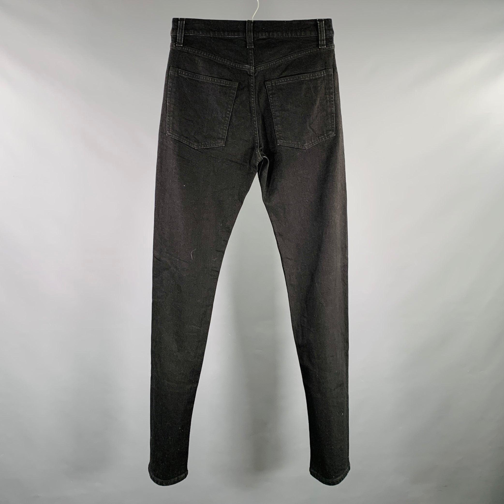 HELMUT LANG jeans
in a black cotton stretch blend woven fabric featuring a five pockets style,, straight leg, and button fly closure. Made in Italy.Excellent Pre-Owned Condition. 

Marked:   W 28/M 31 

Measurements: 
  Waist: 31 inches Rise: 10