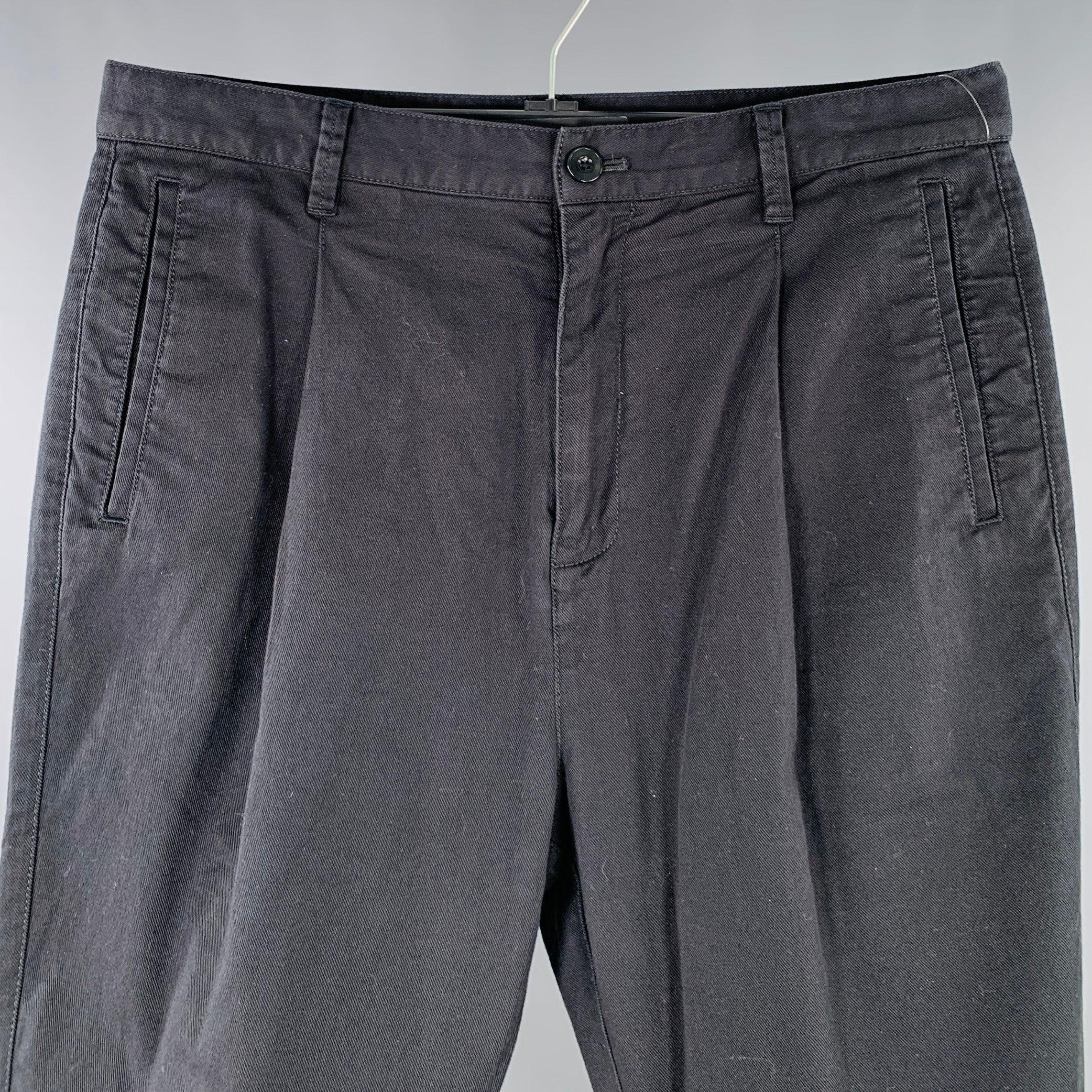 HELMUT LANG casual pants
in a black cotton stretch blend twill featuring a pleated style, cuffed design, and zip fly closure. Excellent Pre-Owned Condition. 

Marked:   32 

Measurements: 
  Waist: 32 inches Rise: 11.5 inches Inseam: 22 inches 
  
 