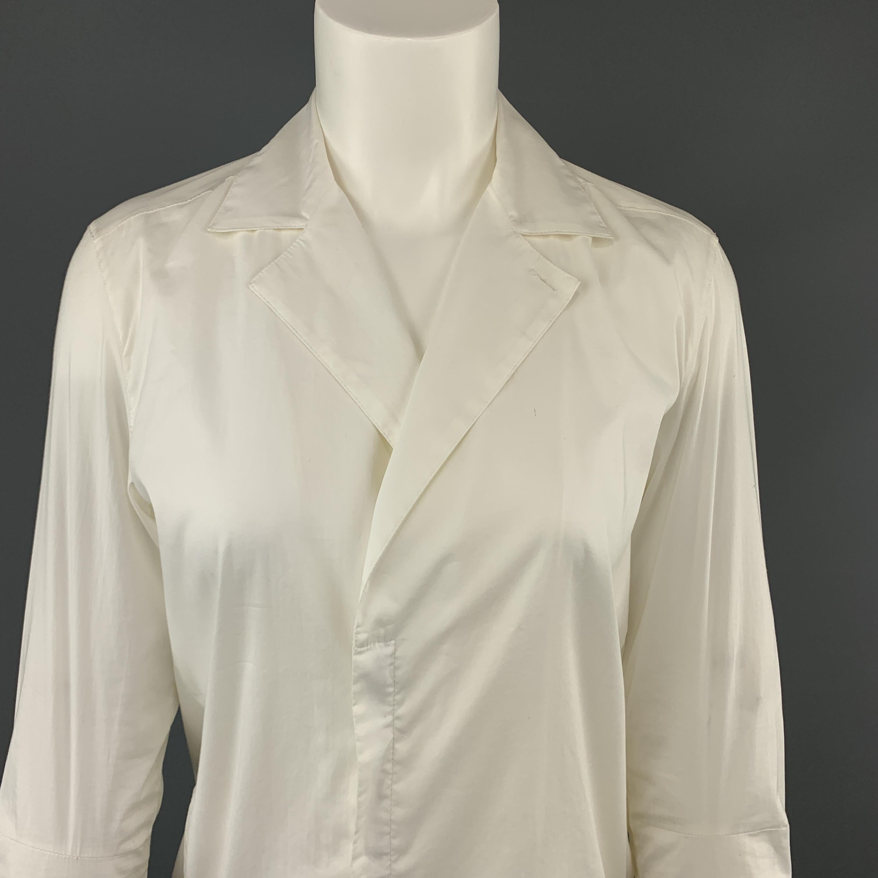 HELMUT LANG shirt dress comes in white stretch cotton with a pointed lapel, double breasted hidden placket zip closure, and high low hem. Wear throughout. As-is.
 
Good Pre-Owned Condition.
Marked: 4
 
Measurements:
 
Shoulder: 14 in.
Bust: 40