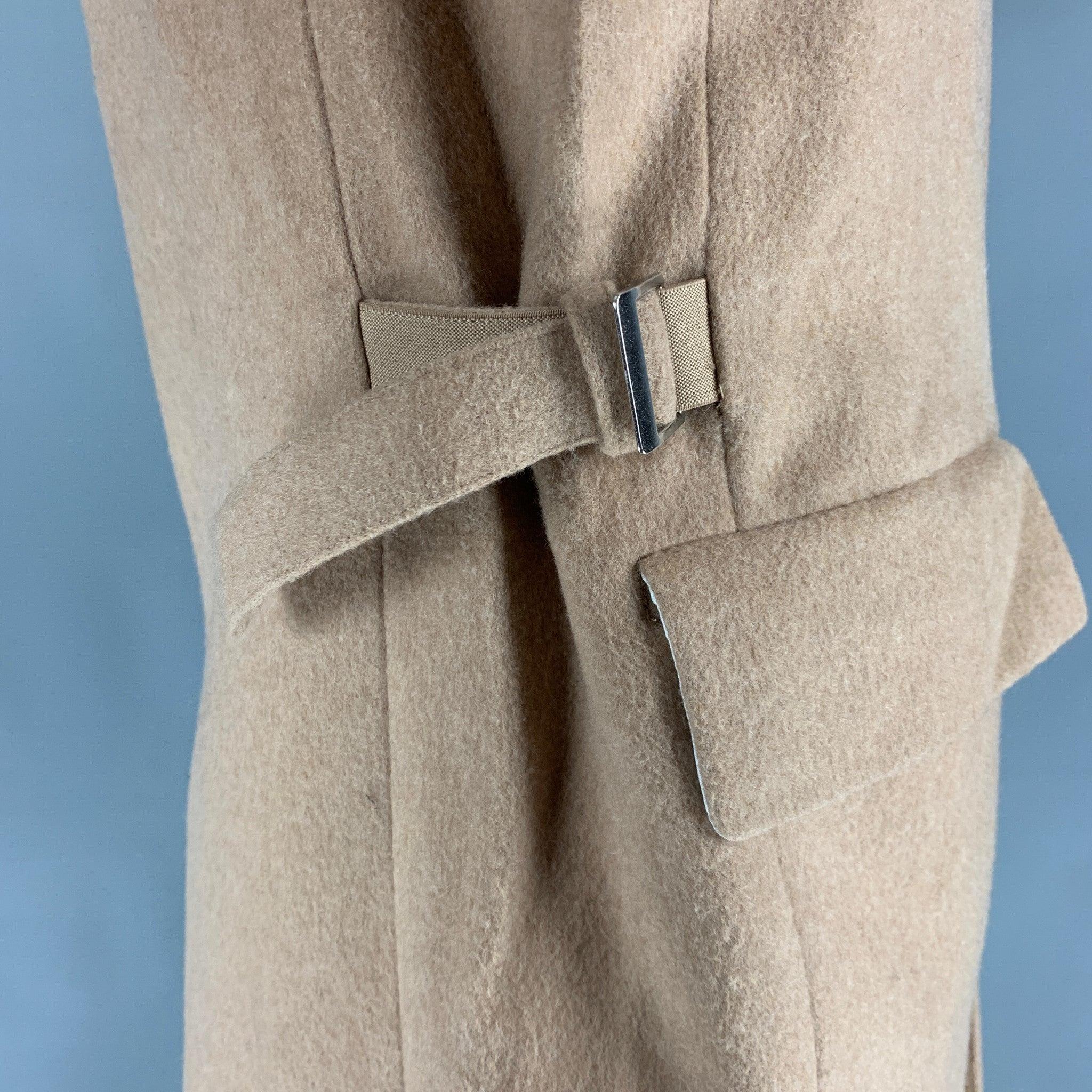 HELMUT LANG coat comes in a beige wool & cashmere blend, featuring a notch lapel, and flap pockets and adjustable tabs around the waist.Excellent Pre-Owned Condition. 

Marked:  42 

Measurements: 
 
Shoulder: 19 inches Chest: 42 inches Sleeve: 27