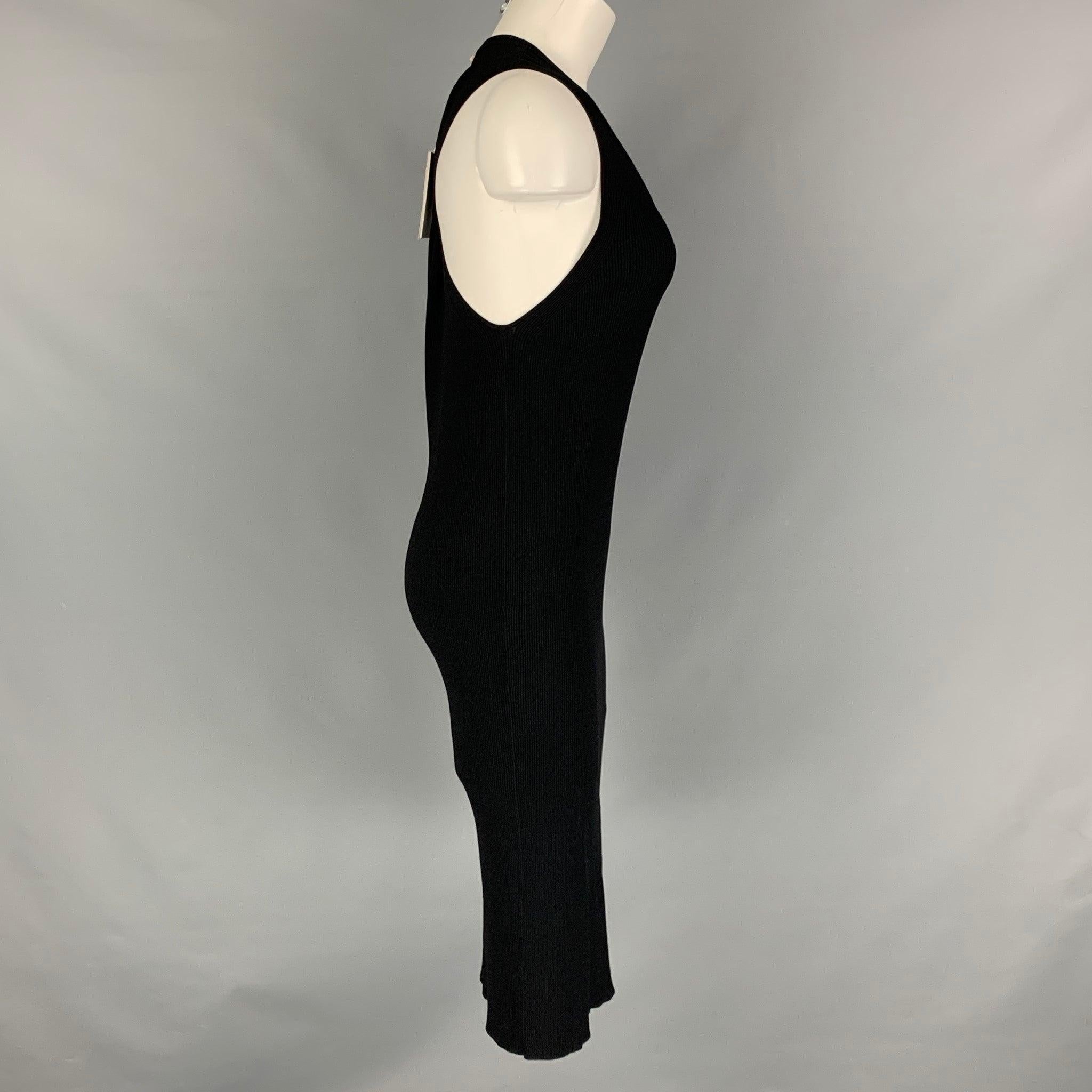HELMUT LANG midi dress comes in black ribbed knit jersey fabric with a body con style, and twisted detail at back.New with Tags. 

Marked:   L 

Measurements: 
 
Shoulder: 11.5 inches Bust: 38 inches Waist: 34 inches Hip: 38 inches Length: 45 inches