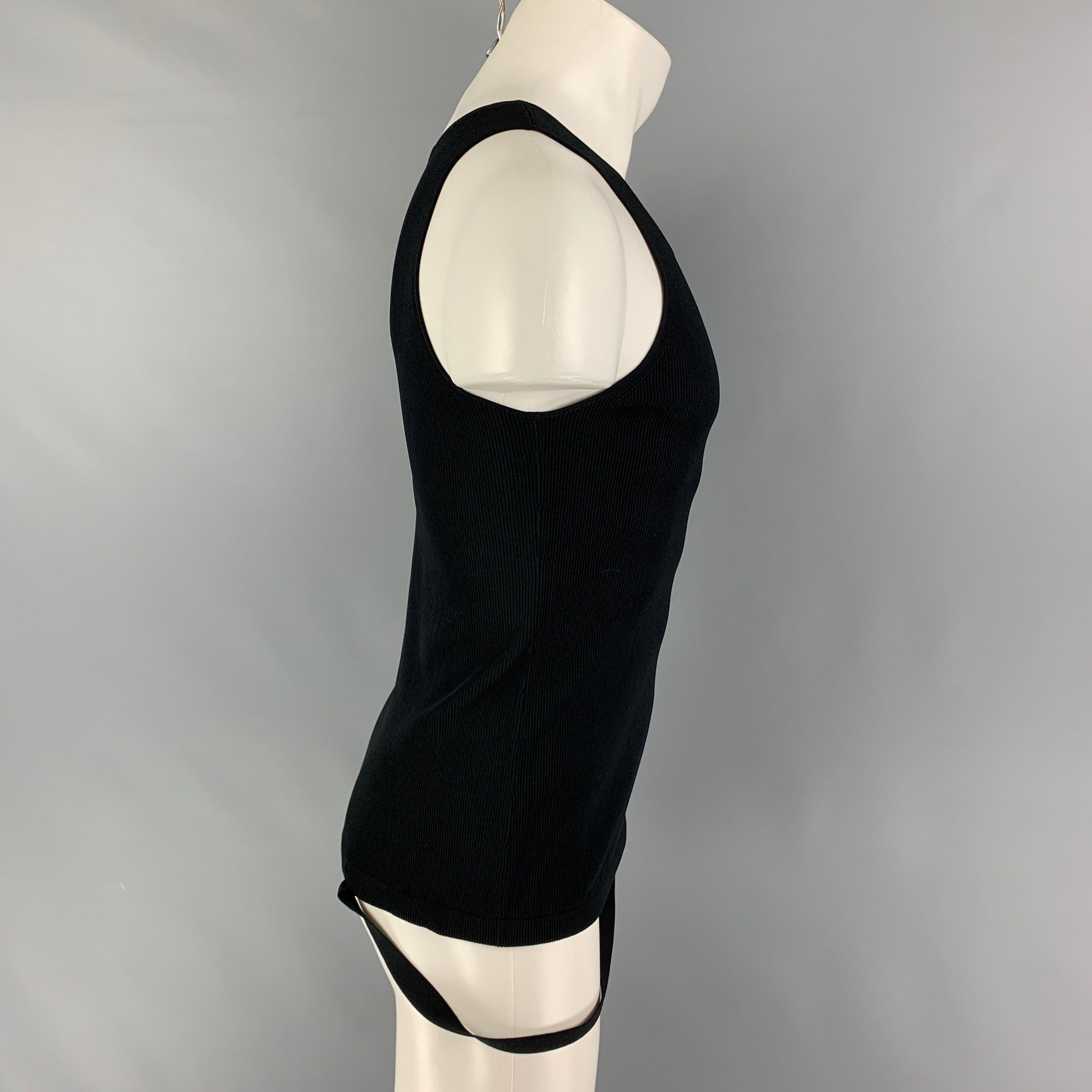 HELMUT LANG tank top comes in a black ribbed viscose blend featuring a parachute strap.
New With Tags.
 

Marked:   L  

Measurements: 
 
Shoulder: 11 inches  Chest: 31 inches  Length: 23 inches 
  
  
 
Reference: 117068
Category: Tank Top
More