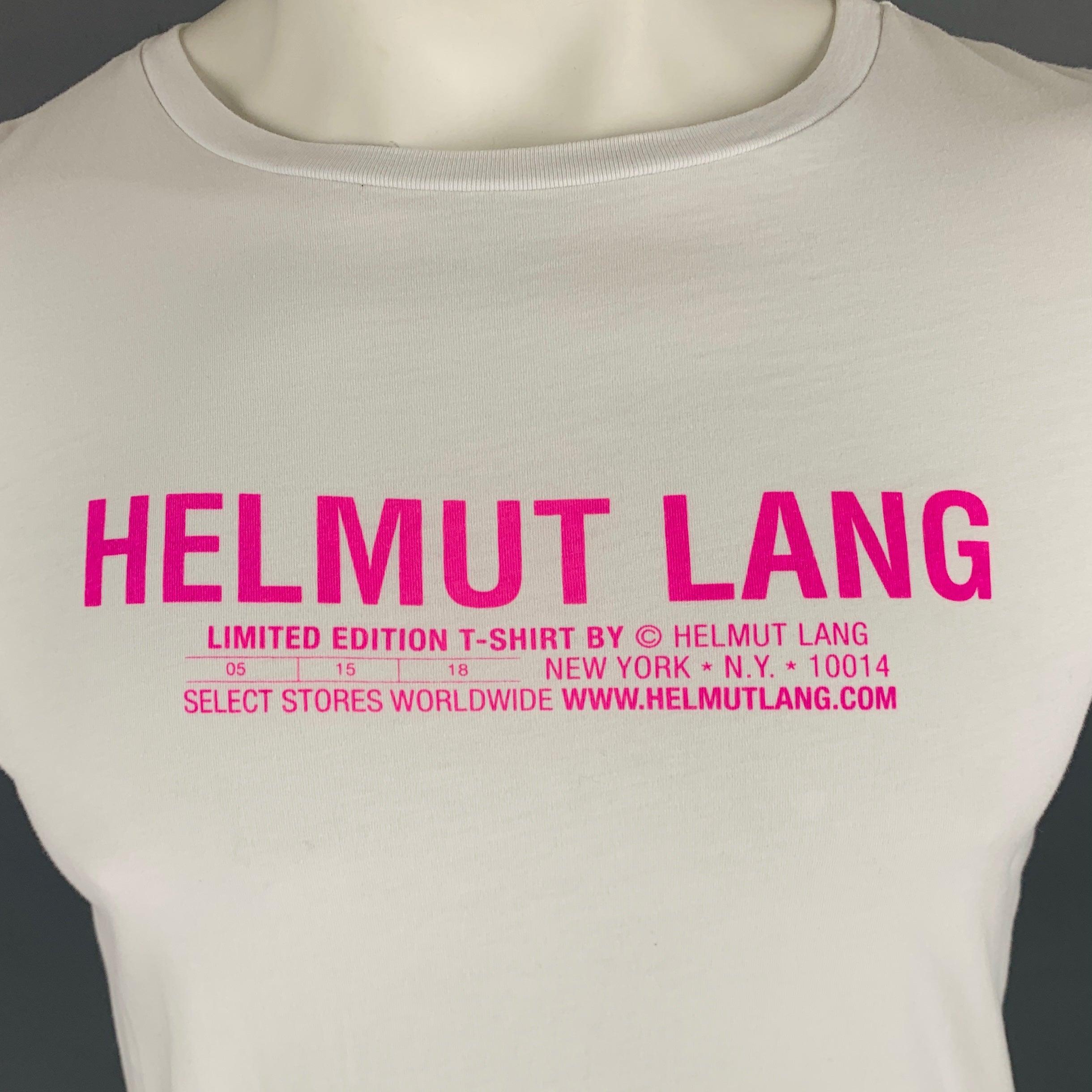HELMUT LANG t-shirt
in a white cotton fabric featuring pink logo and crew neck. This shirt was made as part of a limited edition drop at the NYC store. Made in Portugal.Very Good Pre-Owned Condition. Minor mark on front. 

Marked:   L