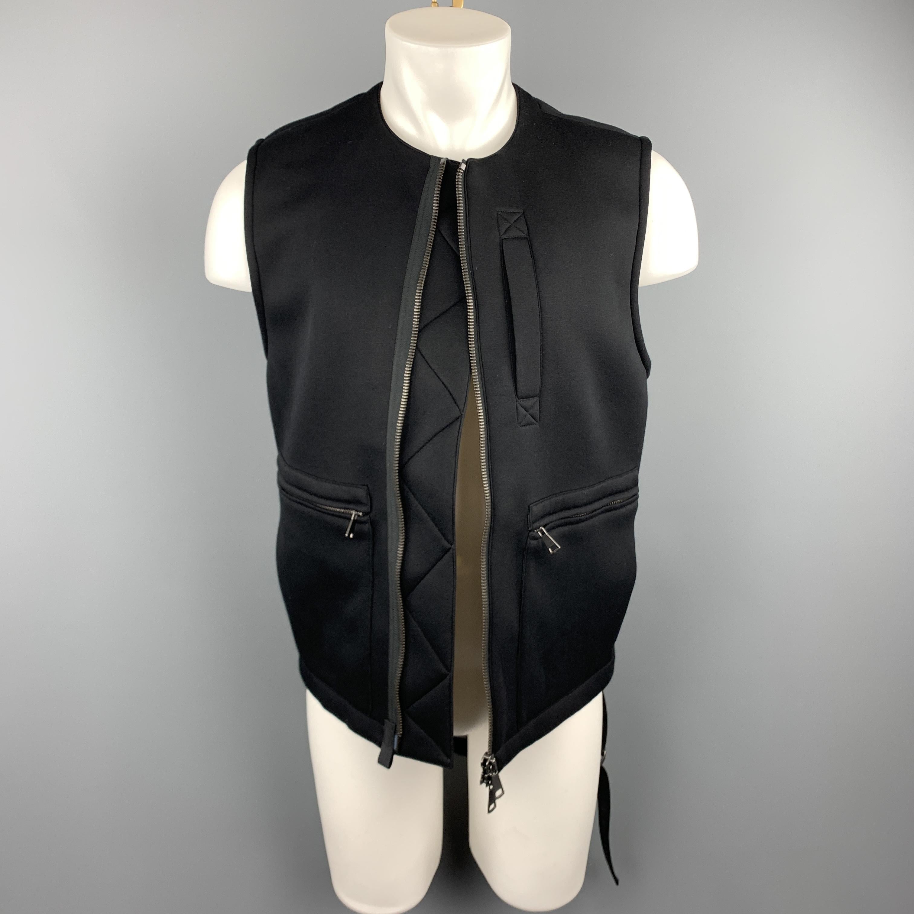 HELMUT LANG tactical style vest comes in black neoprene jersey with a round neck, zip pockets, quilted back waistband, and inner bondage strap. Made in USA.

Excellent Pre-Owned Condition.
Marked: M

Measurements:

Shoulder: 16 in.
Chest: 42