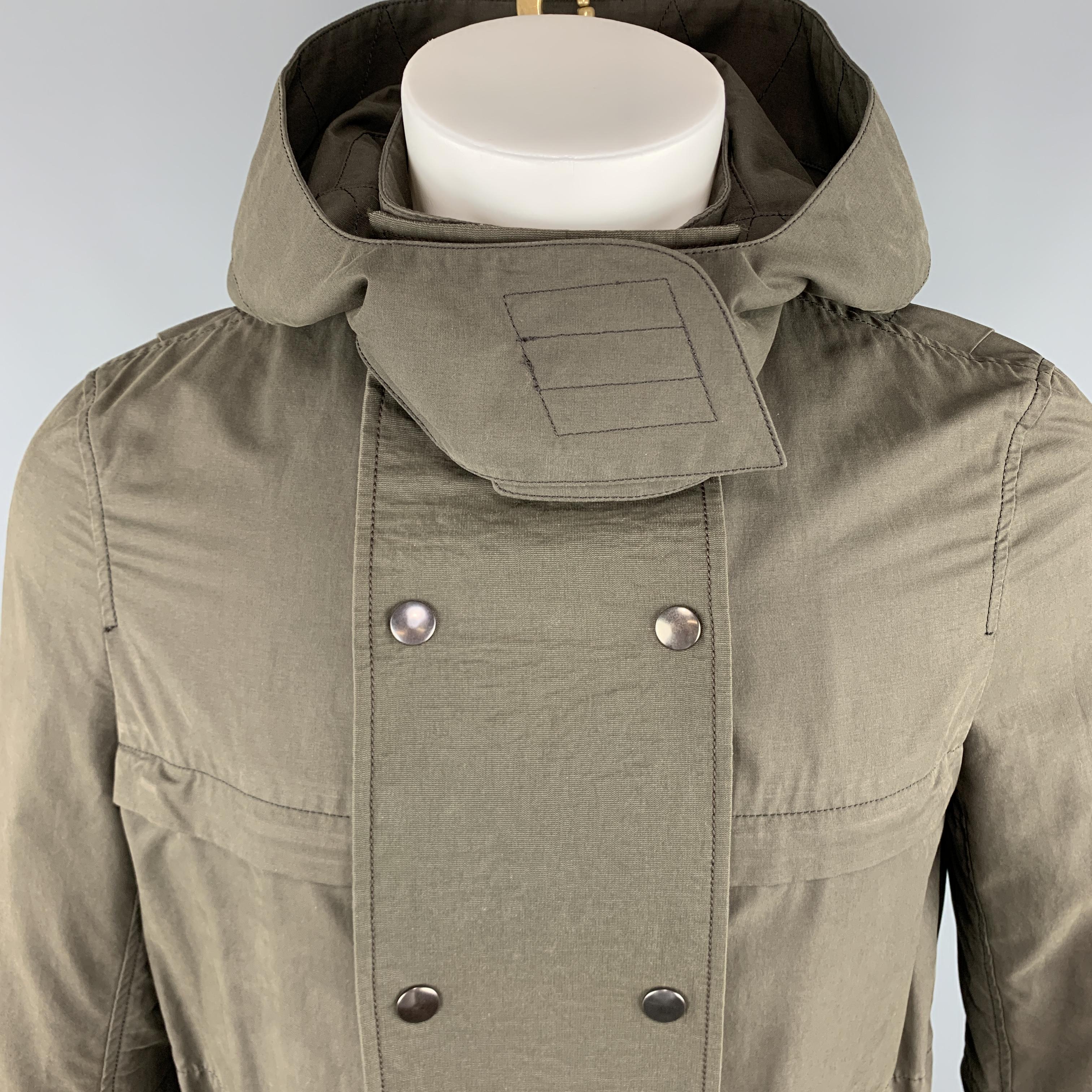 HELMUT LANG Jacket comes in an olive tone in a solid cotton / nylon material, with a high collar, a detachable hood and chest patch detail, zip and cargo pockets, unbuttoned cuffs, zip closure, a drawstring, unlined.

Excellent Pre-Owned