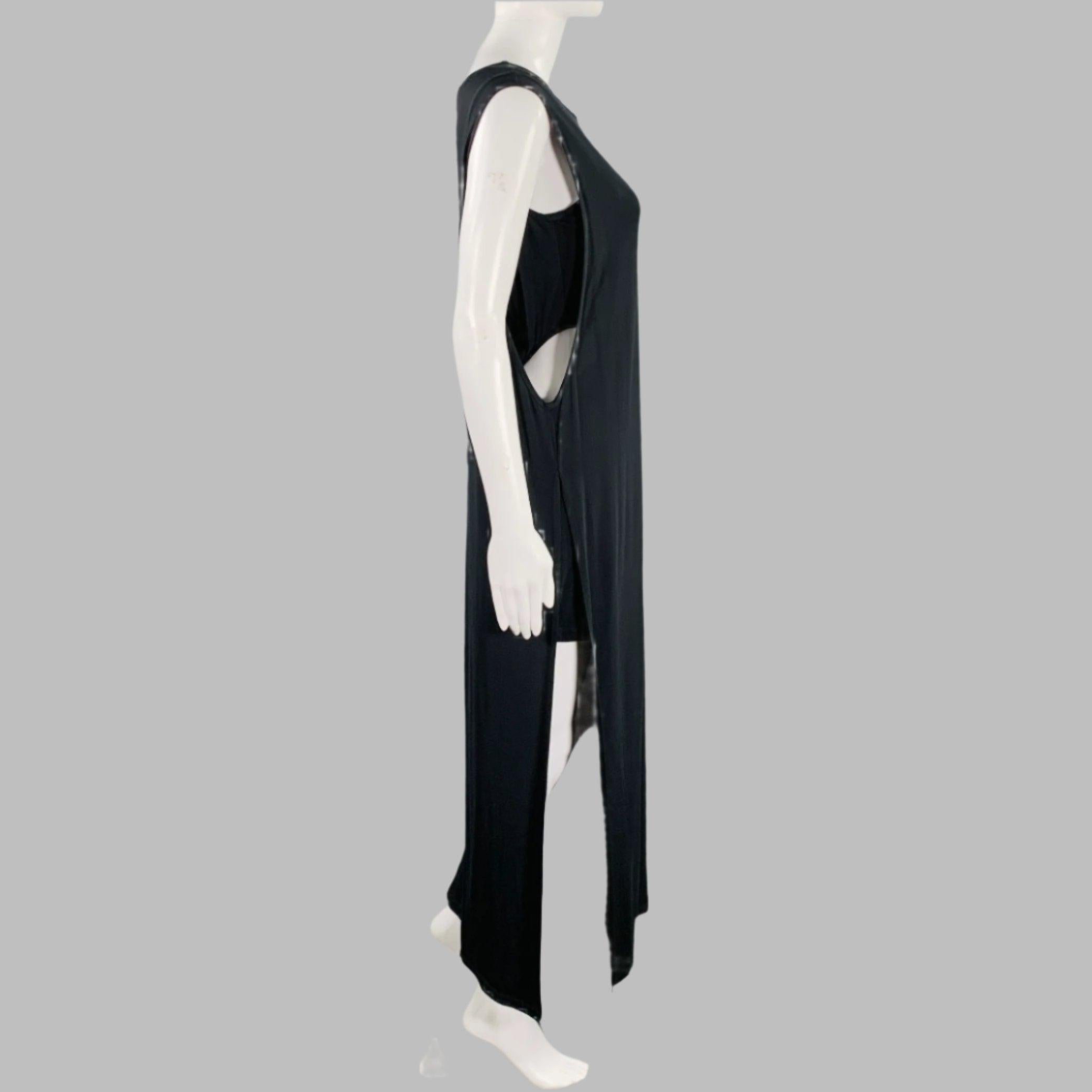 HELMUT LANG dress in a black jersey featuring a shift style, back cut-out detail, and a high slit design.
New With Tags.
 

Marked:   S 

Measurements: 
 
Shoulder: 15 inches  Bust: 34 inches  Length: 49.5 inches 
  
  
 
Sui Generis Reference: