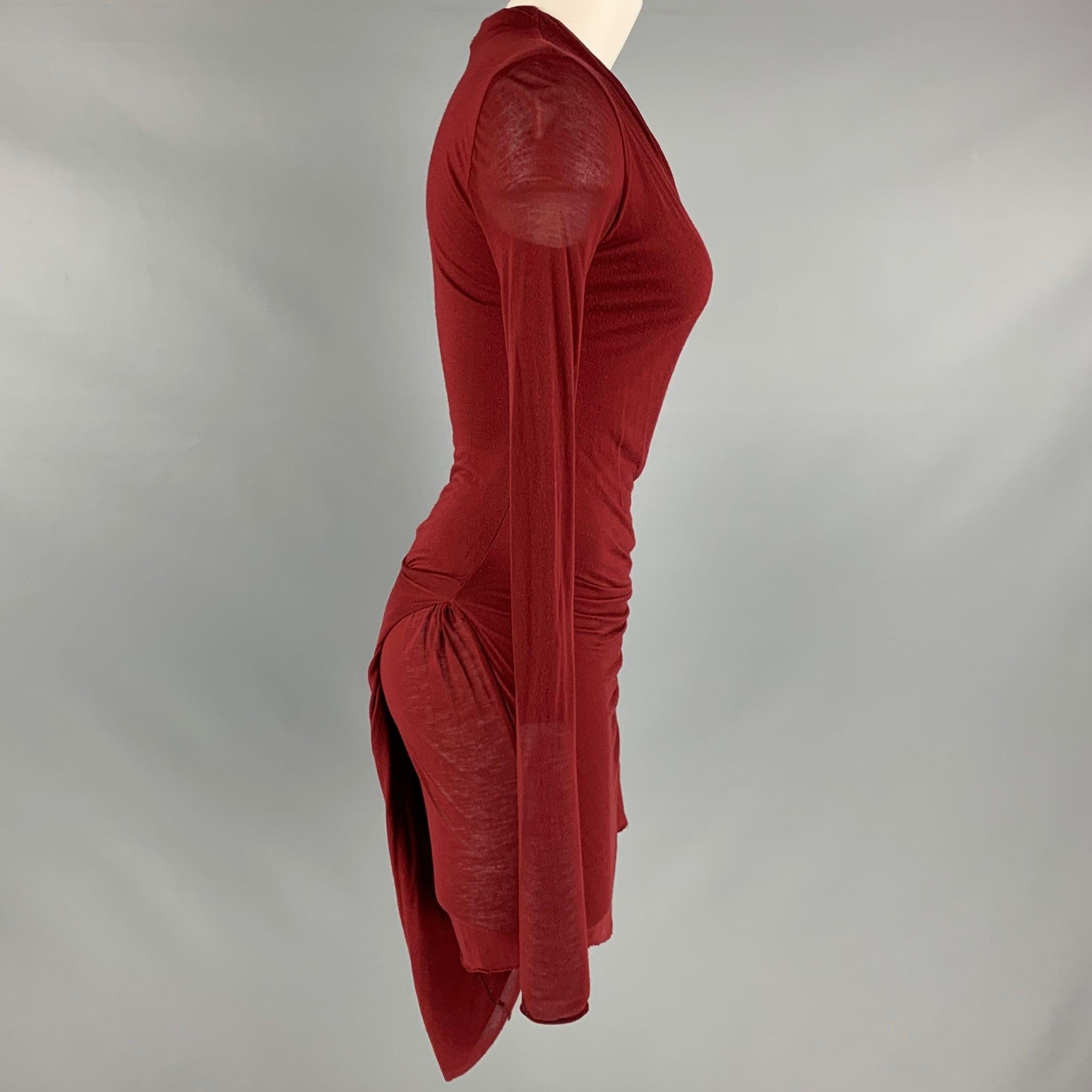 HELMUT LANG dress
in a burgundy modal fabric featuring a cowl neck, and asymmetrical style with side knot. Made in Italy.Good Pre-Owned Condition. Moderate pilling. 

Marked:  S 

Measurements: 
 
Shoulder: 17 inches Bust: 31 inches Sleeve: 29.5