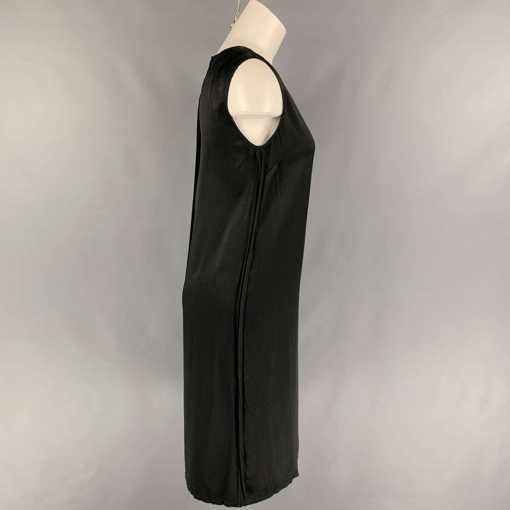 HELMUT LANG dress comes in a black silk featuring a shift style, sleeveless, and a hook & loop closure. 

Very Good Pre-Owned Condition.
Marked: XS

Measurements:

Shoulder: 15 in.
Bust: 32 in.
Length: 41 in. 