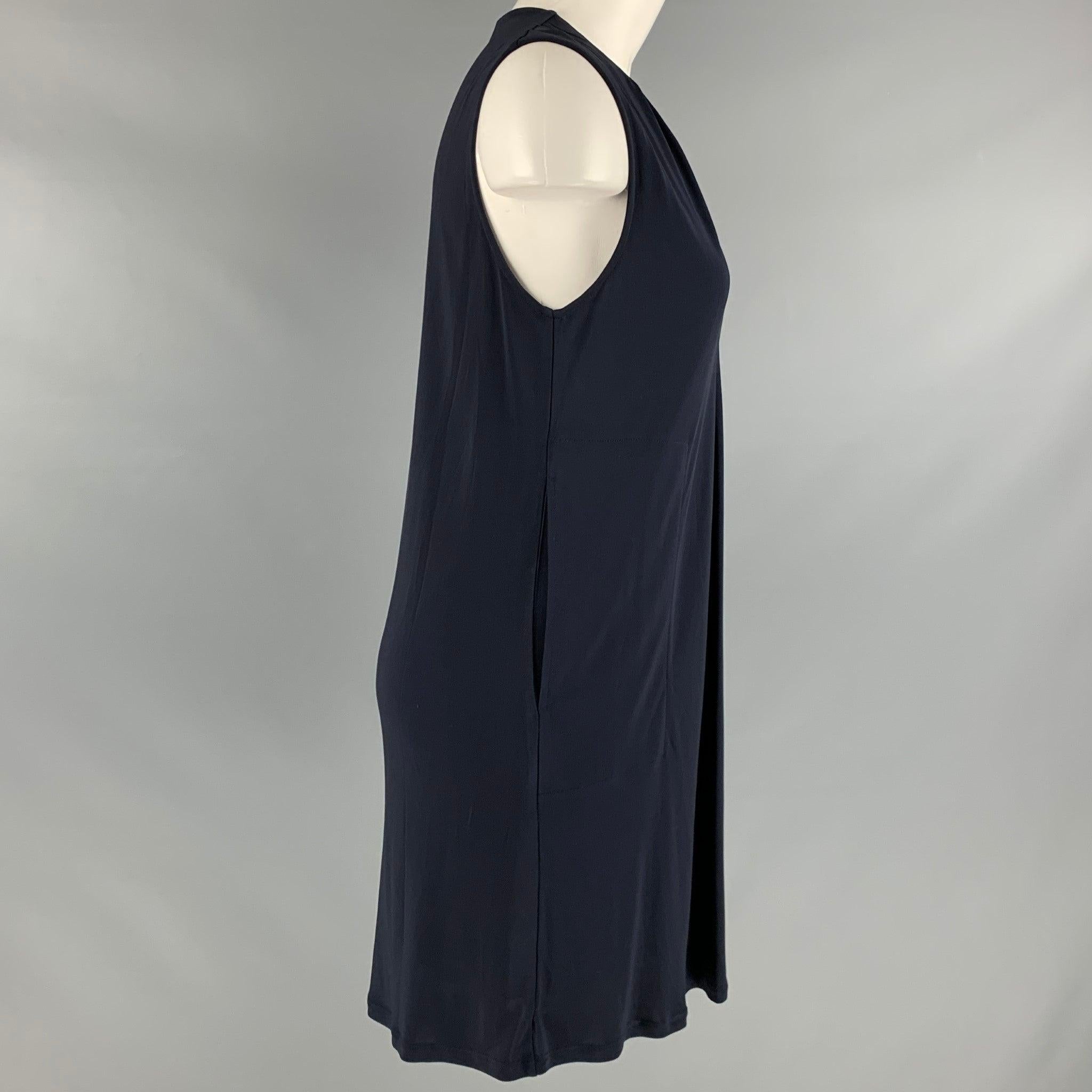 HELMUT LANG dress in a navy viscose fabric featuring a sleeveless A-line style, and two pockets.Very Good Pre-Owned Condition. Marks on front. As-is. 

Marked:  XS 

Measurements: 
 
Shoulder: 15 inches Bust: 32 inches Length: 34 inches 
 
