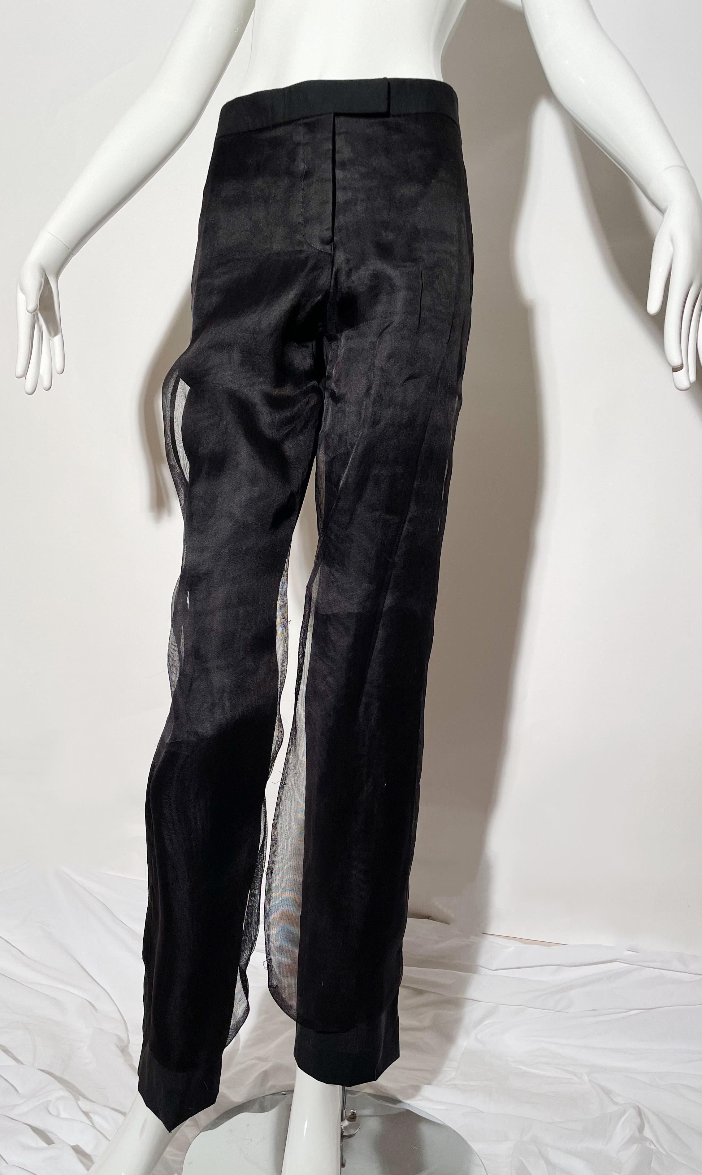 Black trousers with sheer mesh overlay. Tuxedo satin on side. Front and rear pockets. Front zipper closure. Wool and silk blend. Made in Italy.
*Condition: excellent vintage condition. No visible flaws.

Measurements Taken Laying Flat