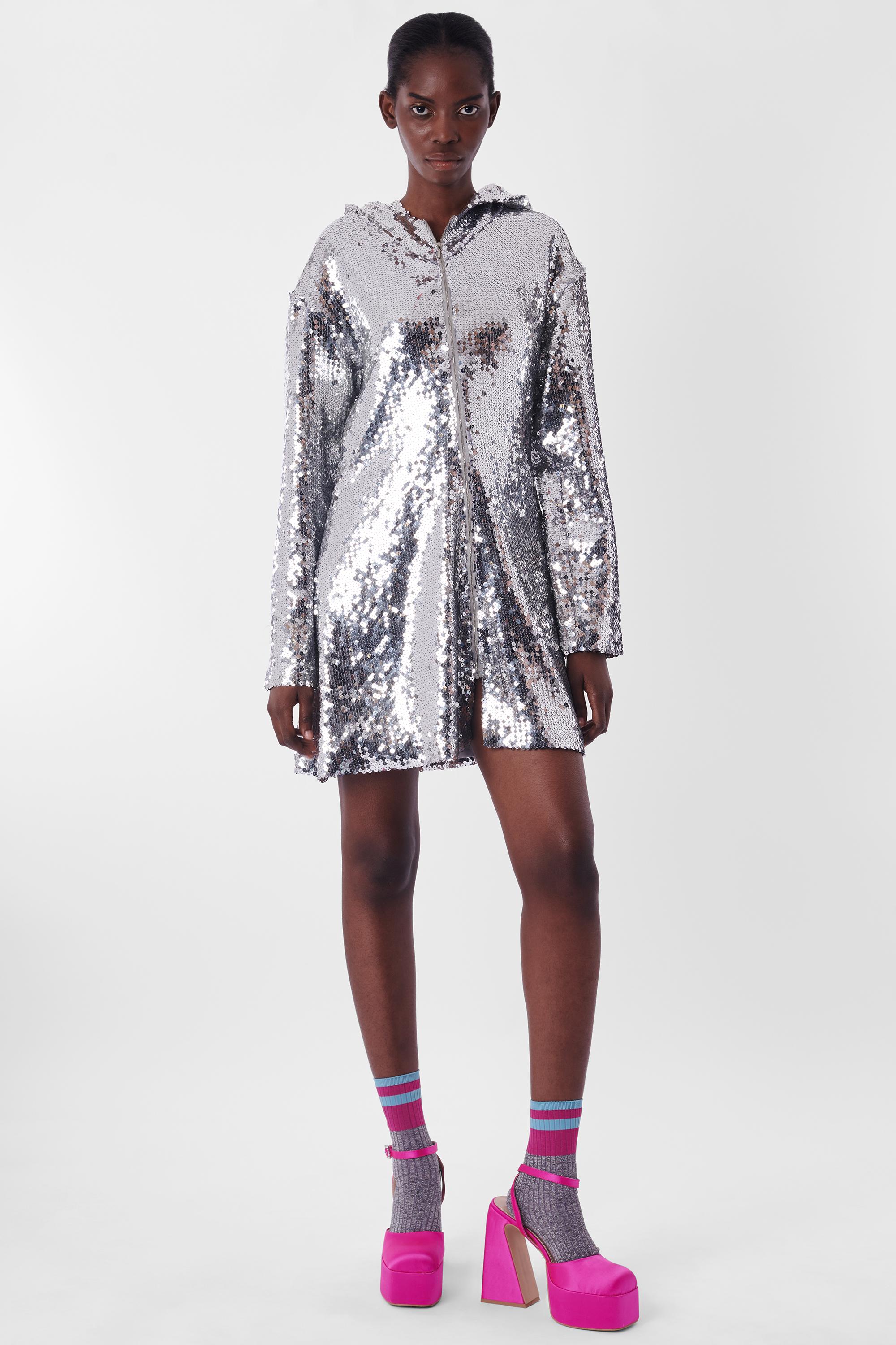 We are excited to present this rare Helmut Lang Vintage 1980's Sequin Hooded Dress. features zipper down front, long sleeves, hood and mini length. In excellent vintage condition. Authenticity guaranteed.

Label size: N/A
Modern size: UK: 8 to 10 ,
