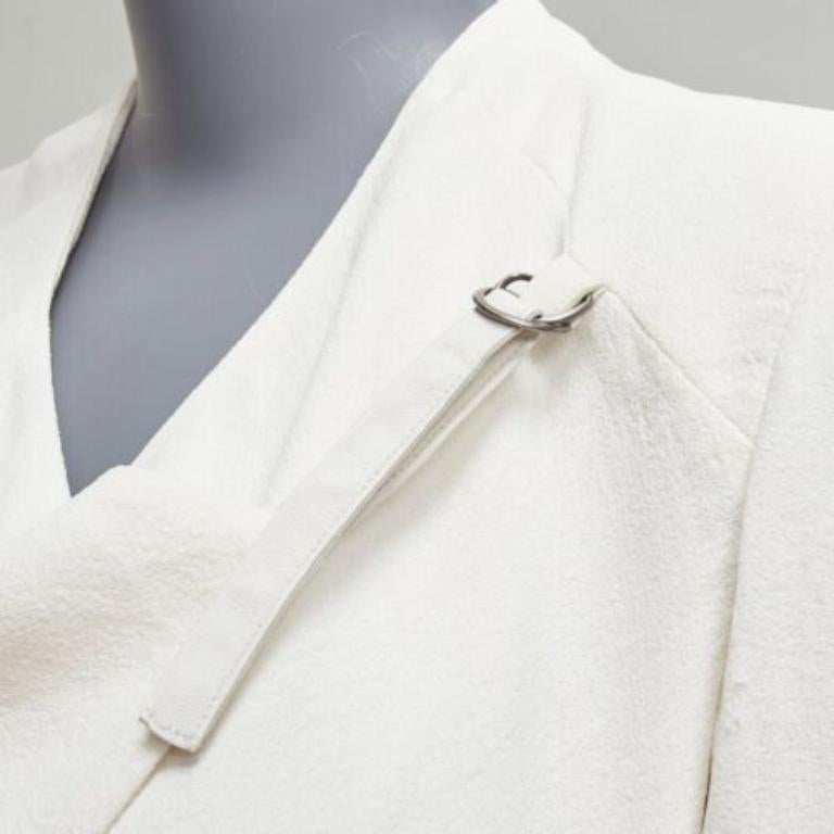 HELMUT LANG white lambskin leather trim asymmetric zip biker jacket US0 XS
Reference: CELG/A00396
Brand: Helmut Lang
Material: Polyester, Lambskin Leather
Color: White
Pattern: Solid
Closure: Belt
Lining: White Fabric
Extra Details: Belt closure at