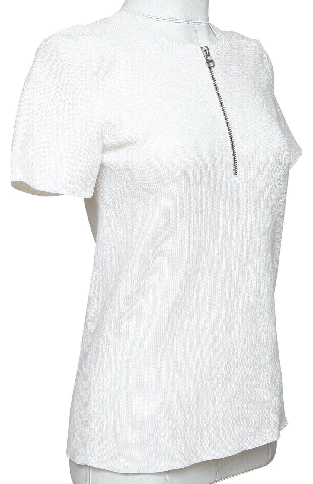 GUARANTEED AUTHENTIC HELMUT LANG WHITE SHORT SLEEVE KNIT TOP

Design:
  - Happy orange polyester knit short sleeve top.
  - Henley style, zipper down front.
  - Crewneck.
  - Slip on.

Size: L

Material: 100% Polyester

Measurements (Approximate