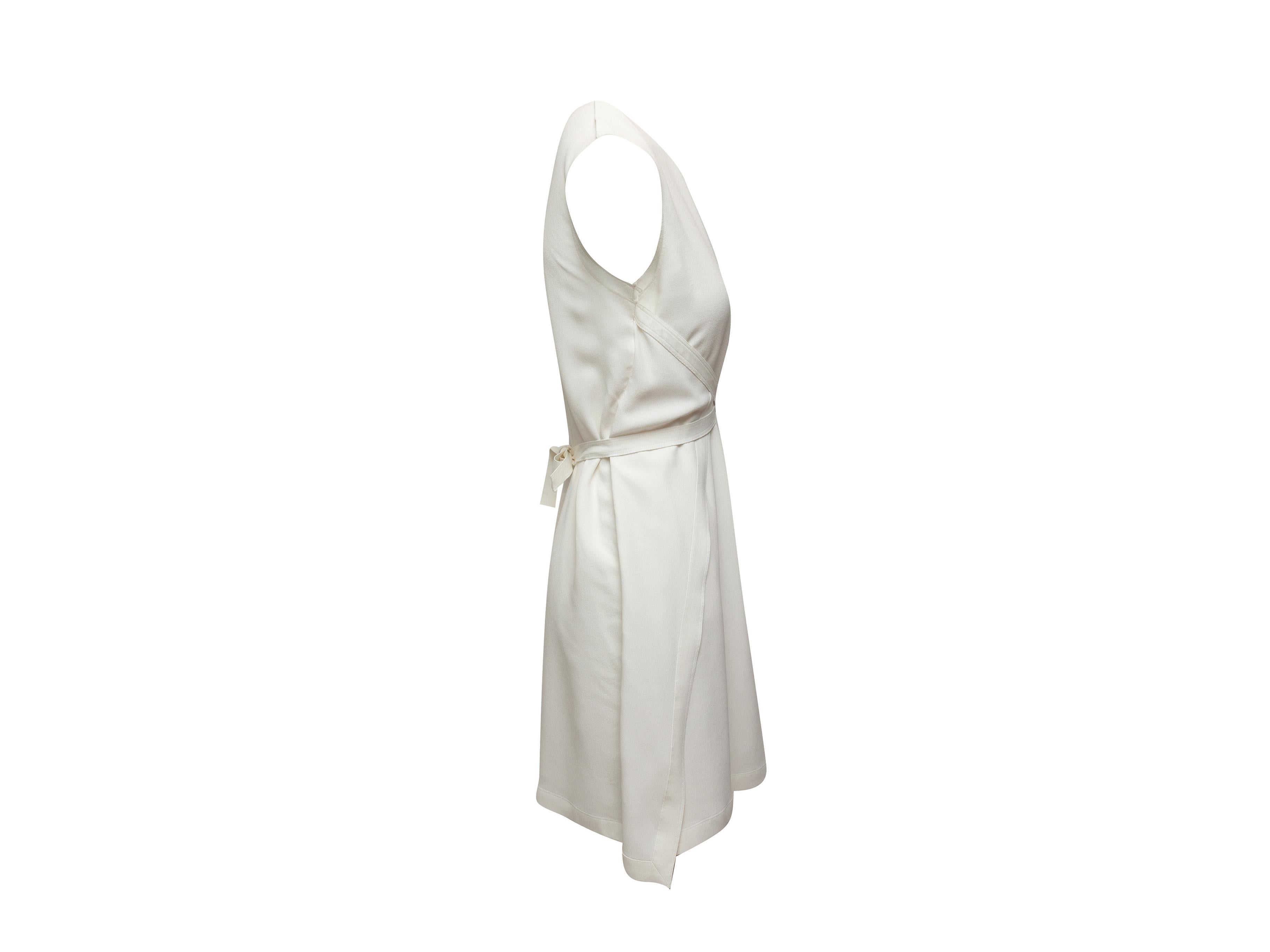 Product details: White sleeveless shift dress by Helmut Lang. Crew neck. Tie at back of waist. 36