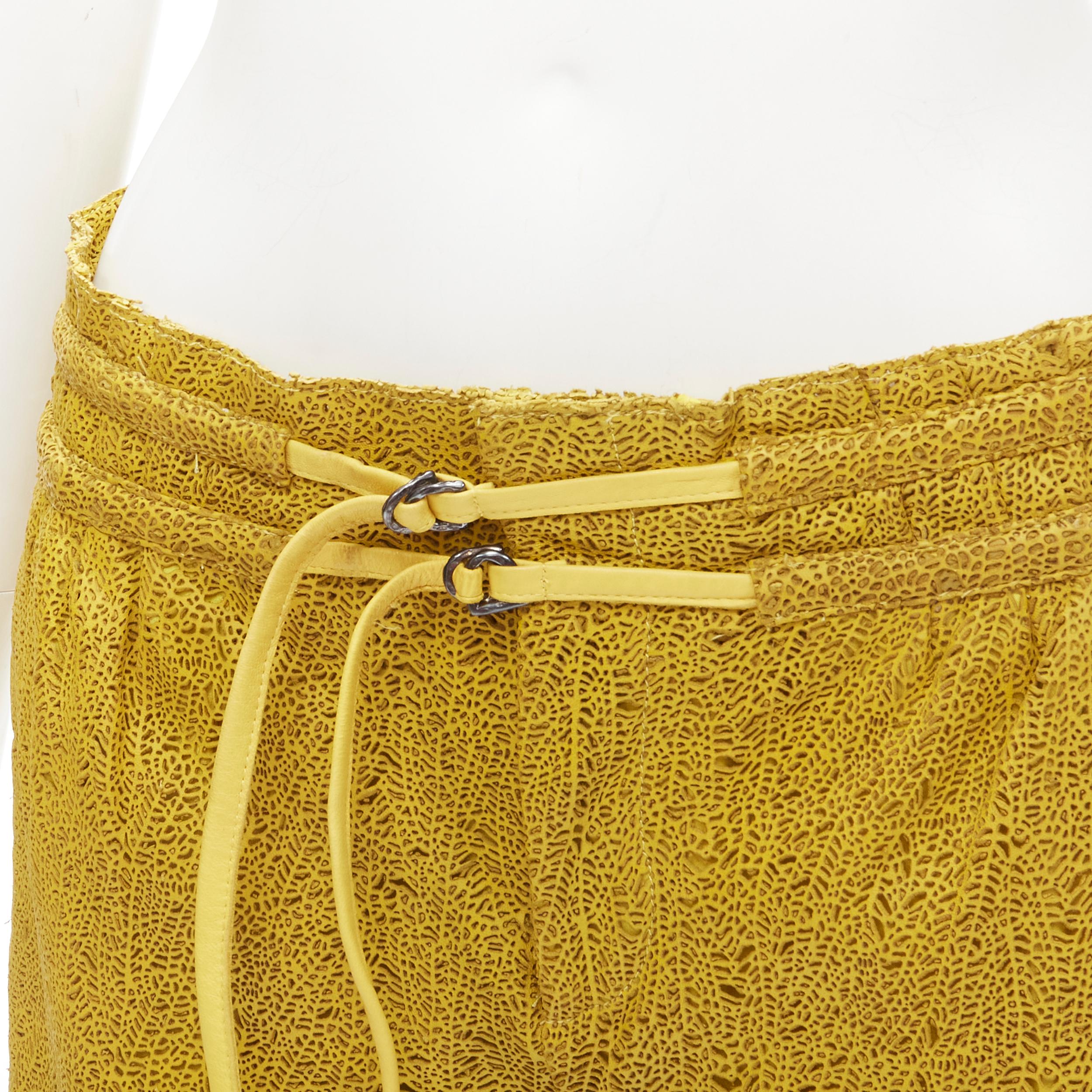 HELMUT LANG yellow laser cut leather lined shorts S 
Reference: ANWU/A00518 
Brand: Helmut Lang 
Material: Leather 
Color: Yellow 
Pattern: Solid 
Closure: Ziip 
Extra Detail: Loop through belt detail. Zip fly. 2-pocket at front. Lined.