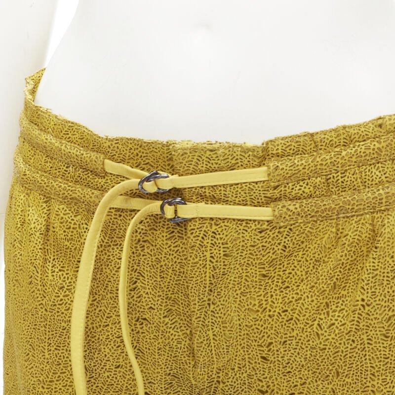 HELMUT LANG yellow laser cut leather lined shorts S
Reference: ANWU/A00518
Brand: Helmut Lang
Material: Leather
Color: Yellow
Pattern: Solid
Closure: Zip
Lining:  Polyester
Extra Details: Loop through belt detail. Zip fly. 2-pocket at front.