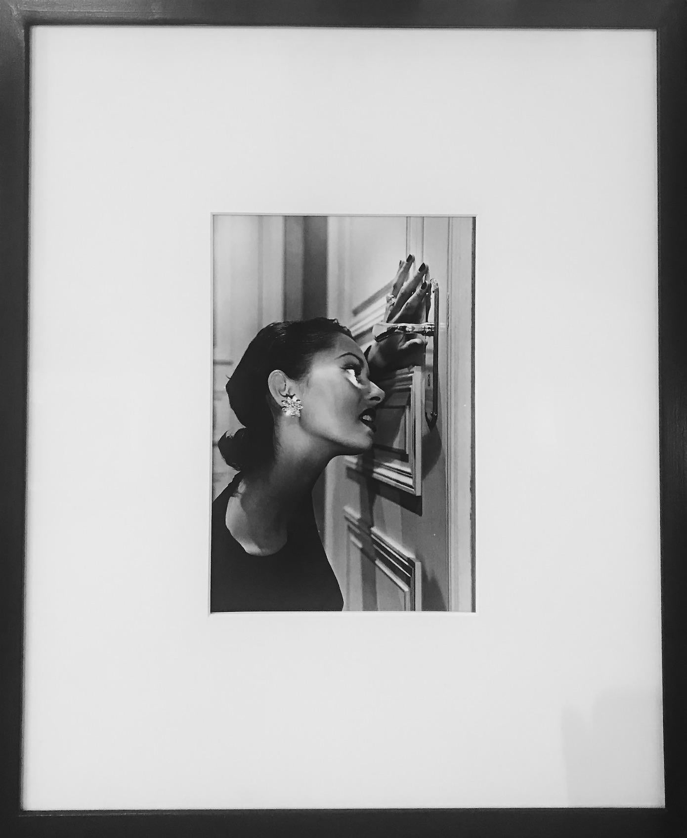 Heather Looking Through a Keyhole, 1994 - Photograph by Helmut Newton