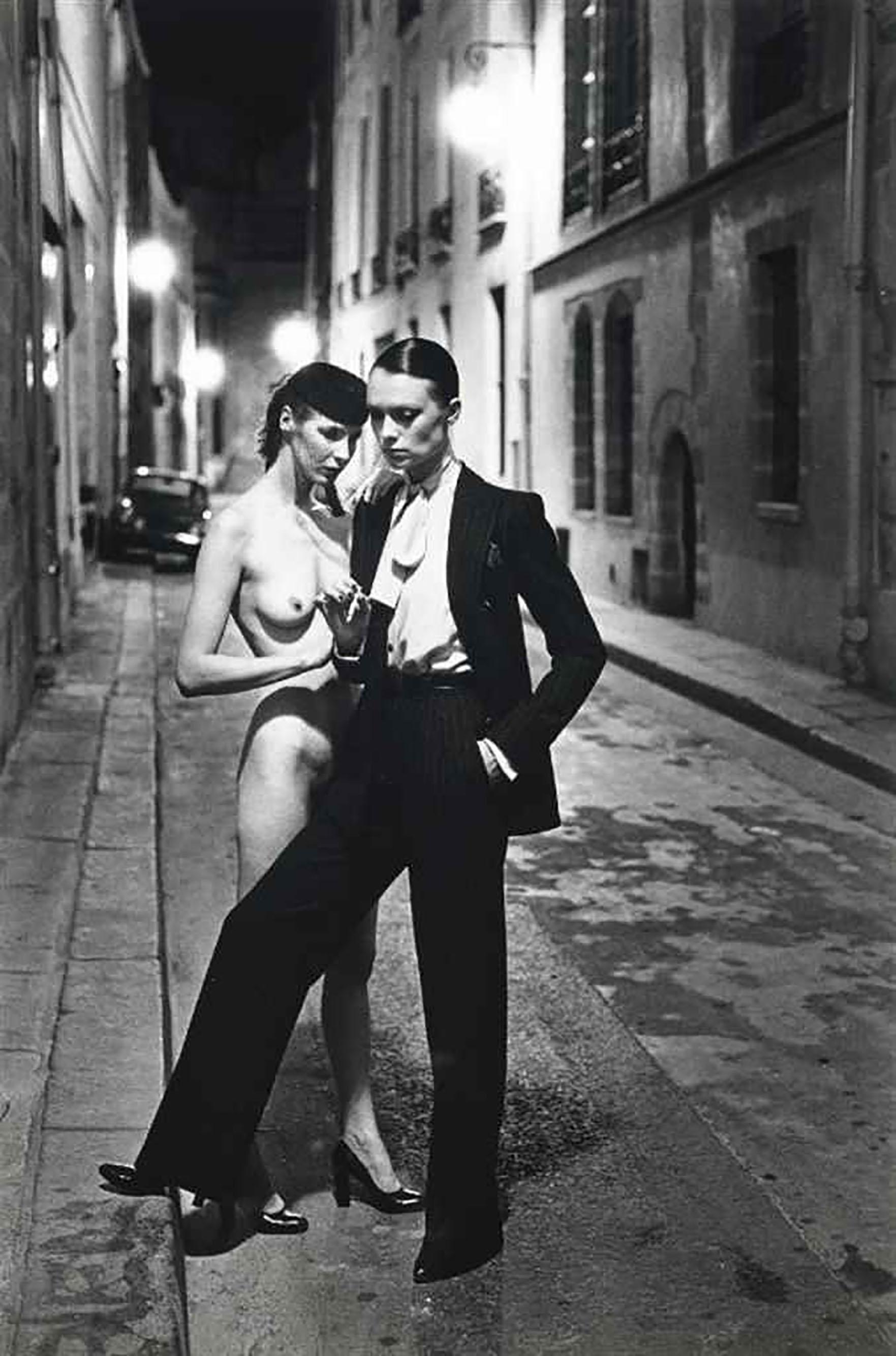 Helmut Newton
 Rue Aubriot
 1975 Signed Original Silver Gelatin Print. 

HELMUT NEWTON (1920–2004)
Yves St. Laurent, Rue Aubriot, French Vogue, Paris, 1975
gelatin silver print
image: 22 5/8 x 14 3/4 in. (57.4 x 37.4 cm.)
sheet: 23 3/4 x 19 3/4 in.