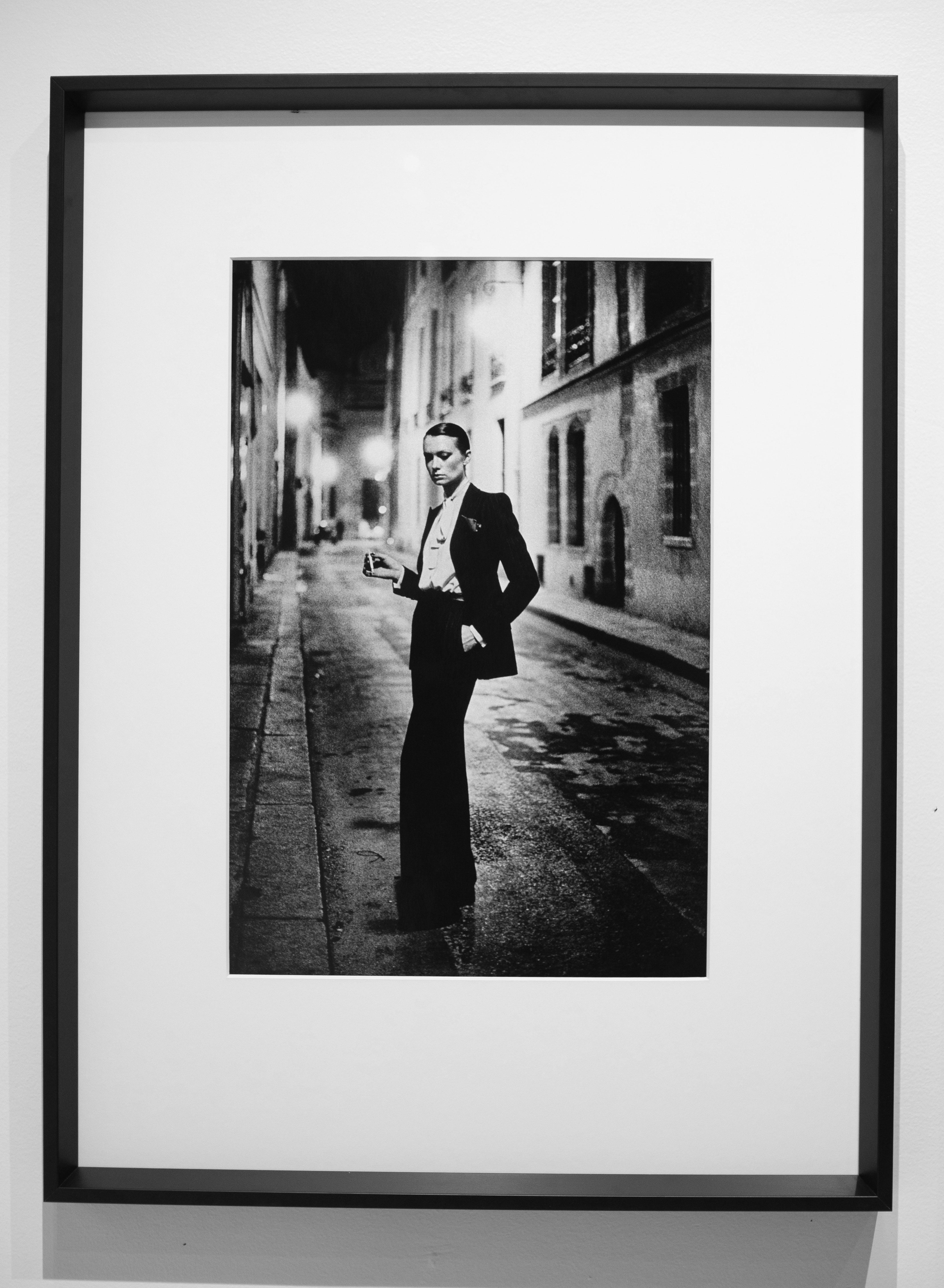 Helmut Newton
 Rue Aubriot
 1975 Signed Original Silver Gelatin Print. 

HELMUT NEWTON (1920–2004)
Yves St. Laurent, Rue Aubriot, French Vogue, Paris, 1975
gelatin silver print
image: 22 5/8 x 14 3/4 in. (57.4 x 37.4 cm.)
sheet: 23 3/4 x 19 3/4 in.