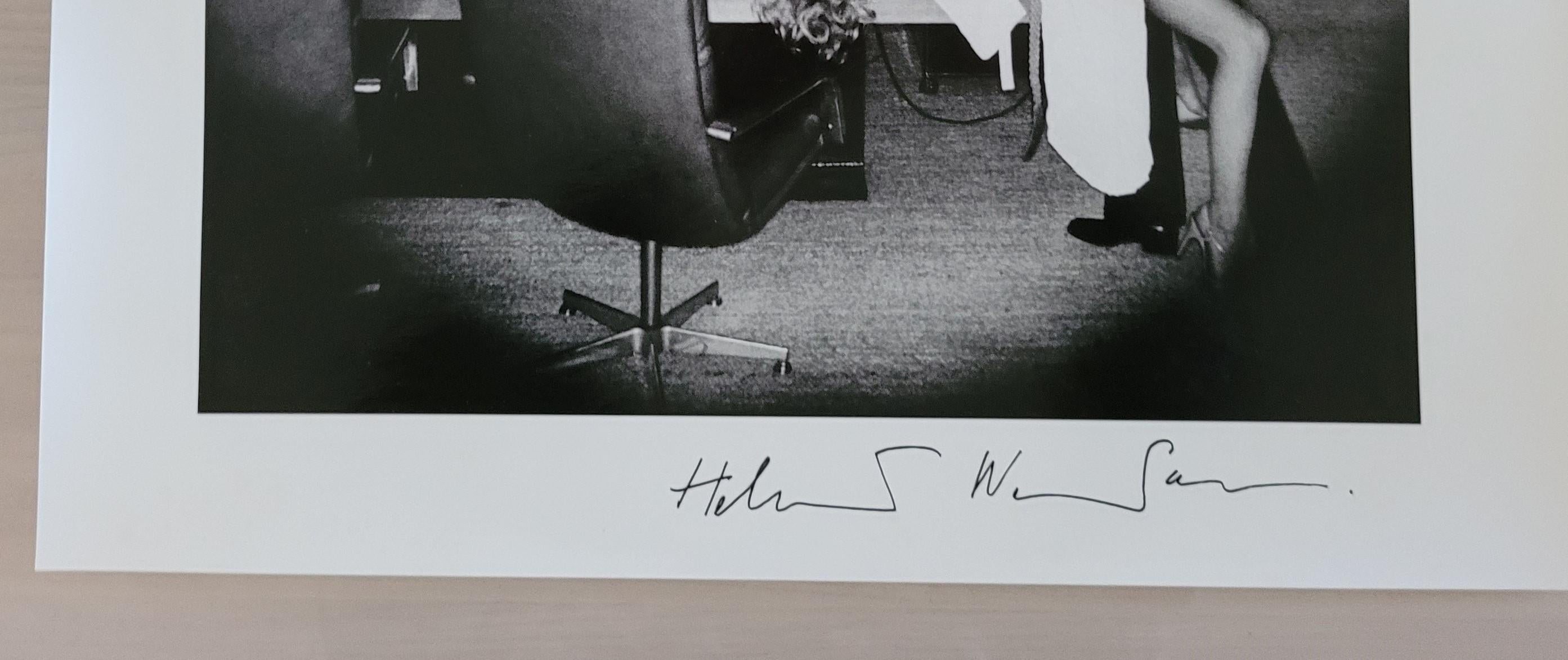 Office Love, 1976

HELMUT NEWTON (1920 -2004)
Gelatin Silver Print.
Signed on front by Helmut Newton. Back is dated “Paris 1982” and with Helmut Newton's copyright stamp.
Condition: Excellent 

A woman and a man pose in a conference or meeting room.