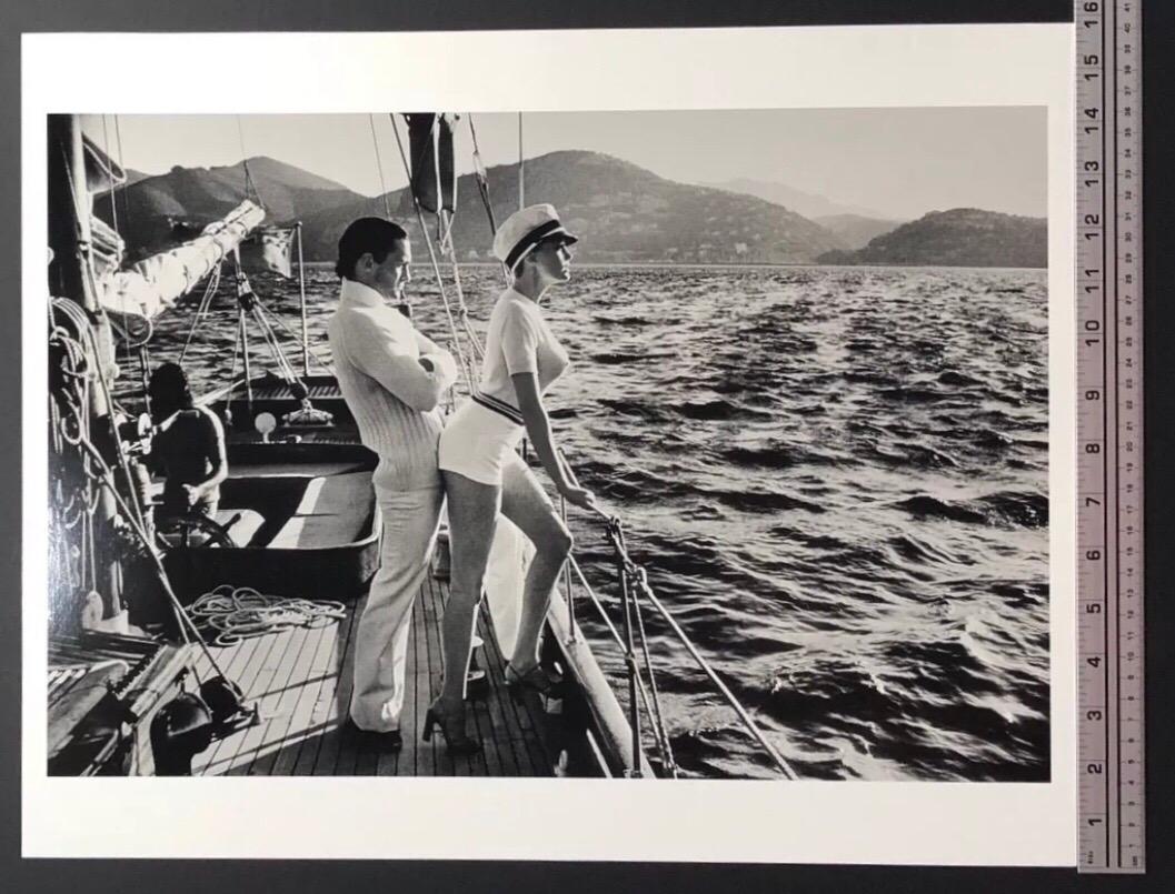 Original silver gelatin print by Helmut Newton titled Winnie on Deck, Cannes, 1975.  Image features model Winnie  and spent much of his career in Monte Carlo. ‘Winnie on Deck', also known as 'Cruising from behind', shows Newton at his overtly sexual
