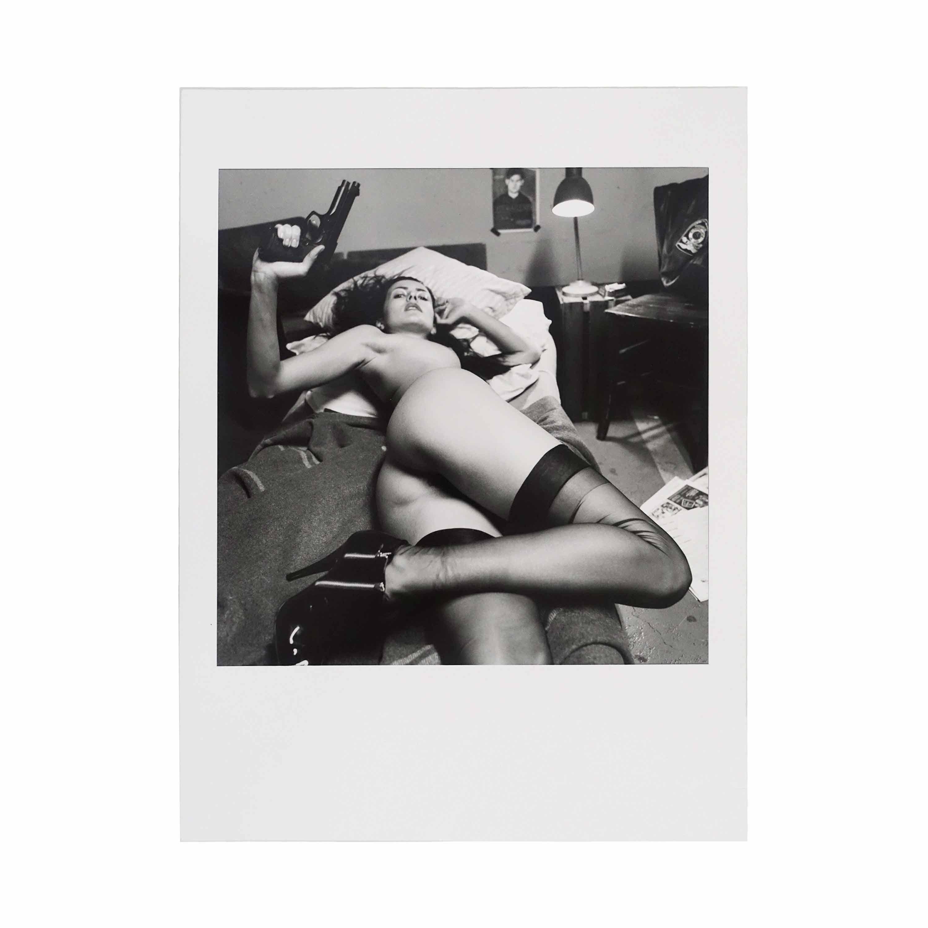 A vintage print by Helmut Newton, dating back to the year 2000, bearing original stamps on the verso and accompanied by a certification of authenticity issued by Davide Manfredi, former Italian representative of the artist.  Original artist stamp on