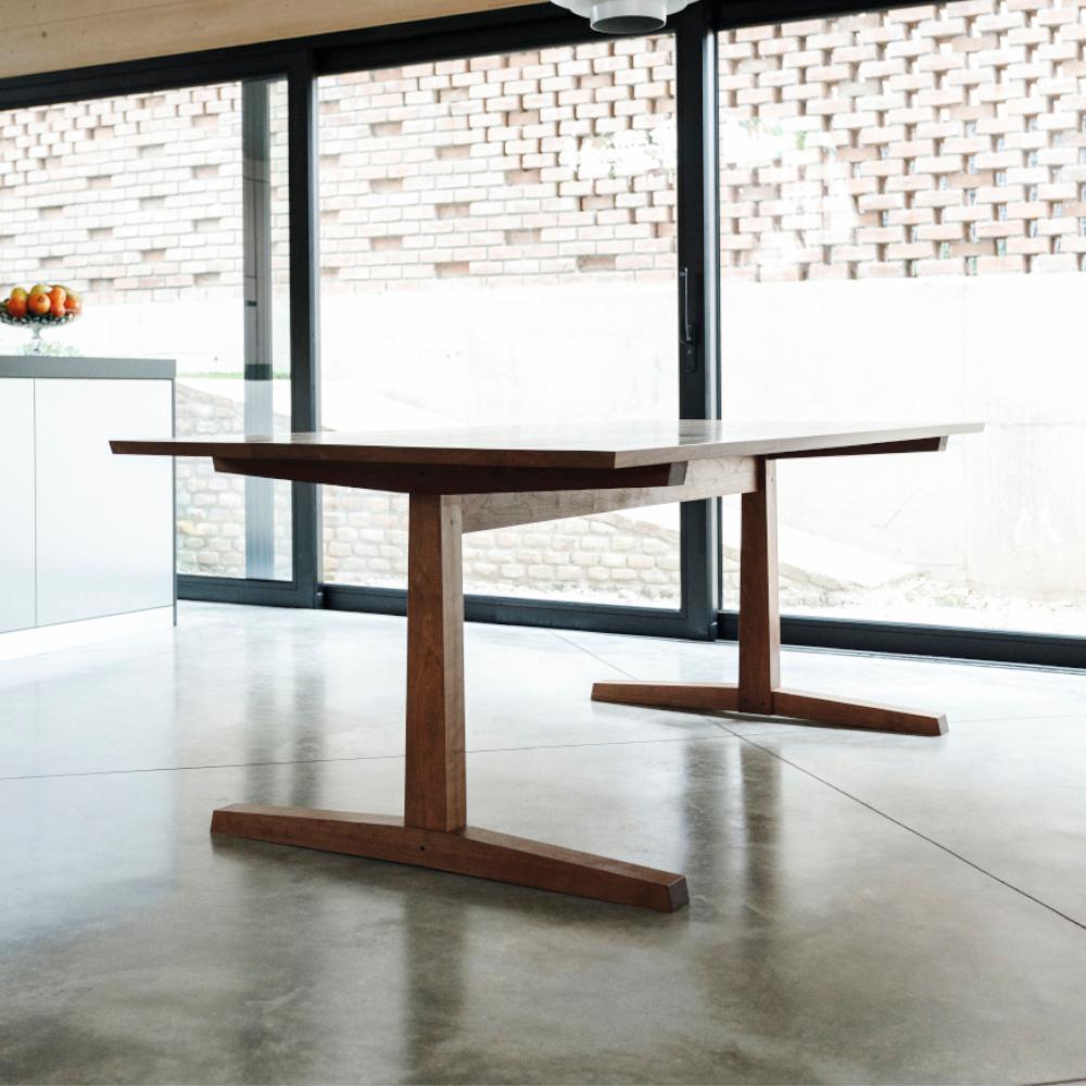 This exceptional table, meticulously handcrafted from American cherry and finished with an oil-wax treatment, is a testament to the enduring dialogue between craftsmanship and spiritual significance. Drawing inspiration from the iconic Hancock