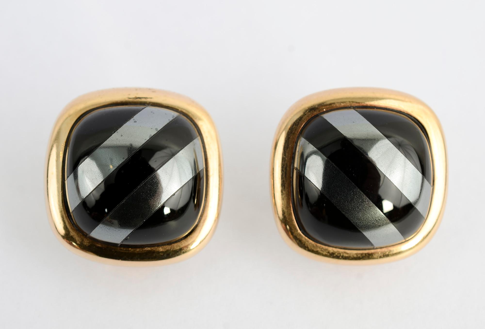 Chic earrings of alternating diagonal stripes of hematite and black onyx framed in gold. The backs are posts and clips. The earrings measure 7/8