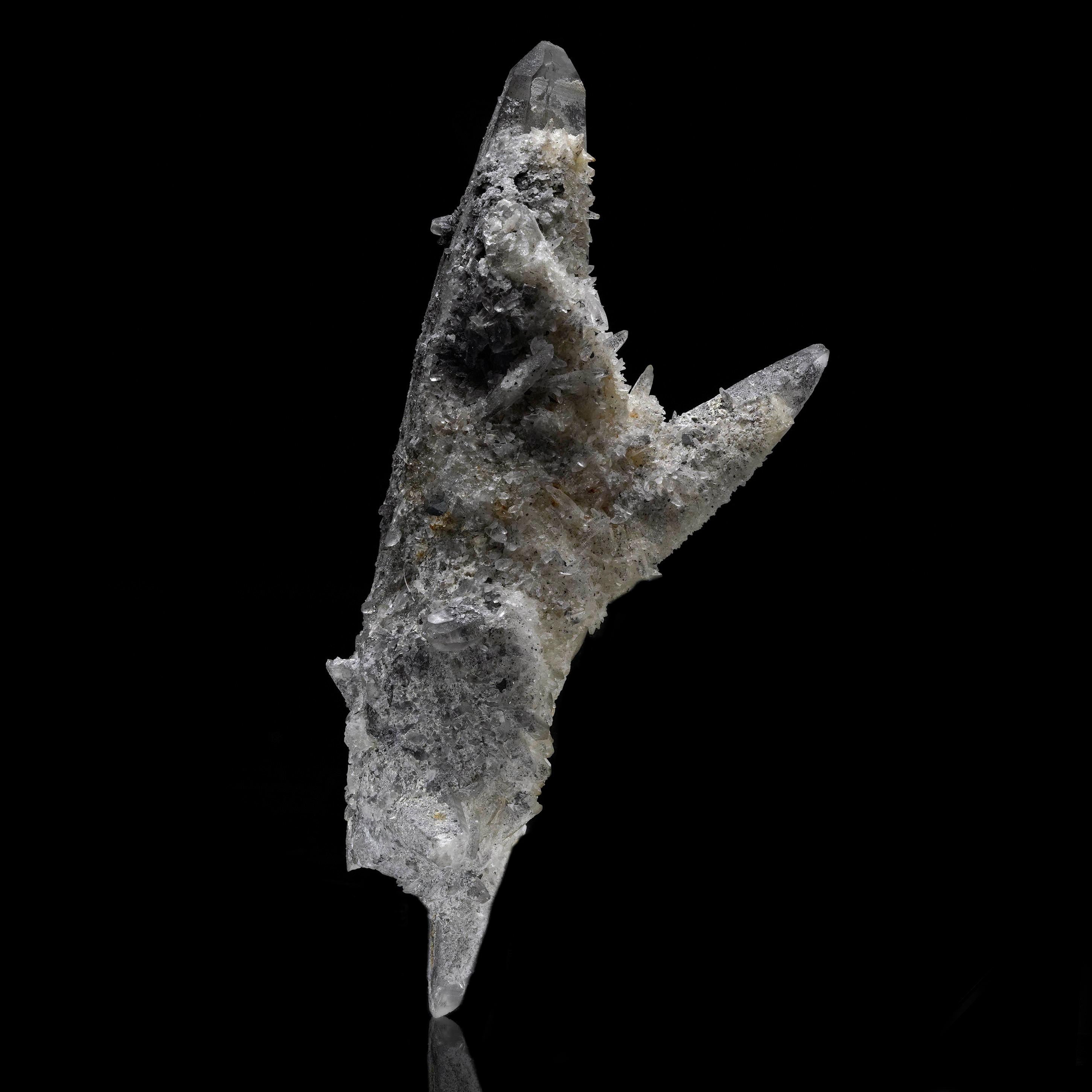 This striking and unique crystal formation features a hefty double terminated Calcite crystal with another double terminated Calcite growing through the bottom at a 90 degree angle. A third Calcite crystal juts from the main double terminated