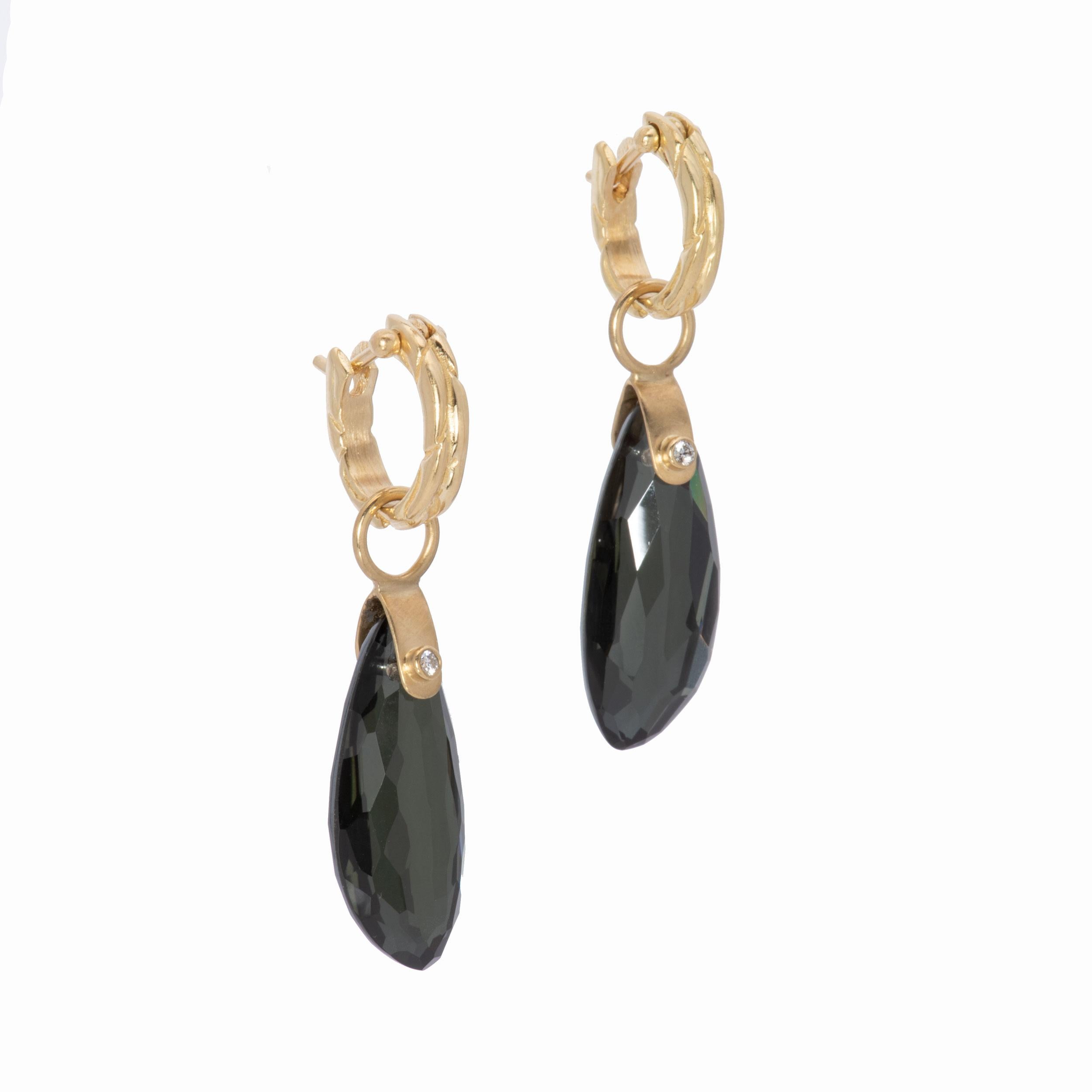 Hematite and lemon quartz combine to create a sophisticated sheen in our Seed Pod Drop Earrings in 18k Gold. Green black faceted seed shapes gleam with lemony green lights and are highlighted with tube set white diamonds .04 ctw. Suspended from our