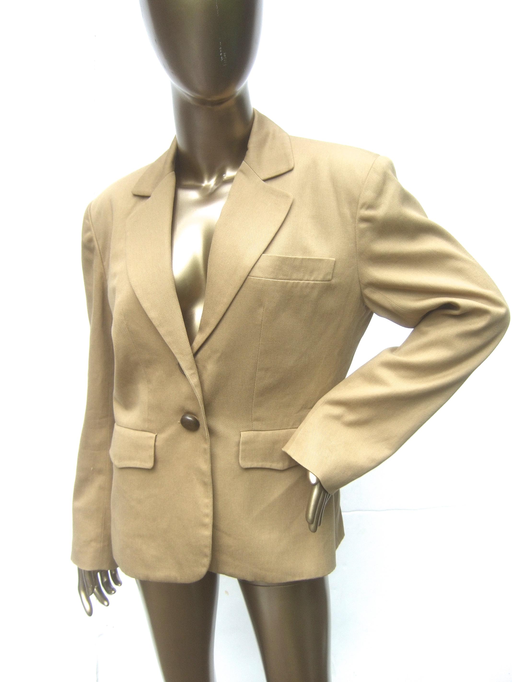 Hermes Paris Khaki cotton blend women's jacket Size 42 
The classic cotton blend jacket is designed with a single chest pocket & a pair of flap covered pockets on the lower front 

Adorned with a pair of burnished brass tone metal buttons on the