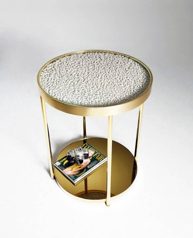 Hemlock side table is the product of the imagination from celebrated Turkish designer Merve Kahraman. 

Its popcorn-like texture is an end result of a natural process in lacquer painting workshops; over many years, layer upon layer of byproducts