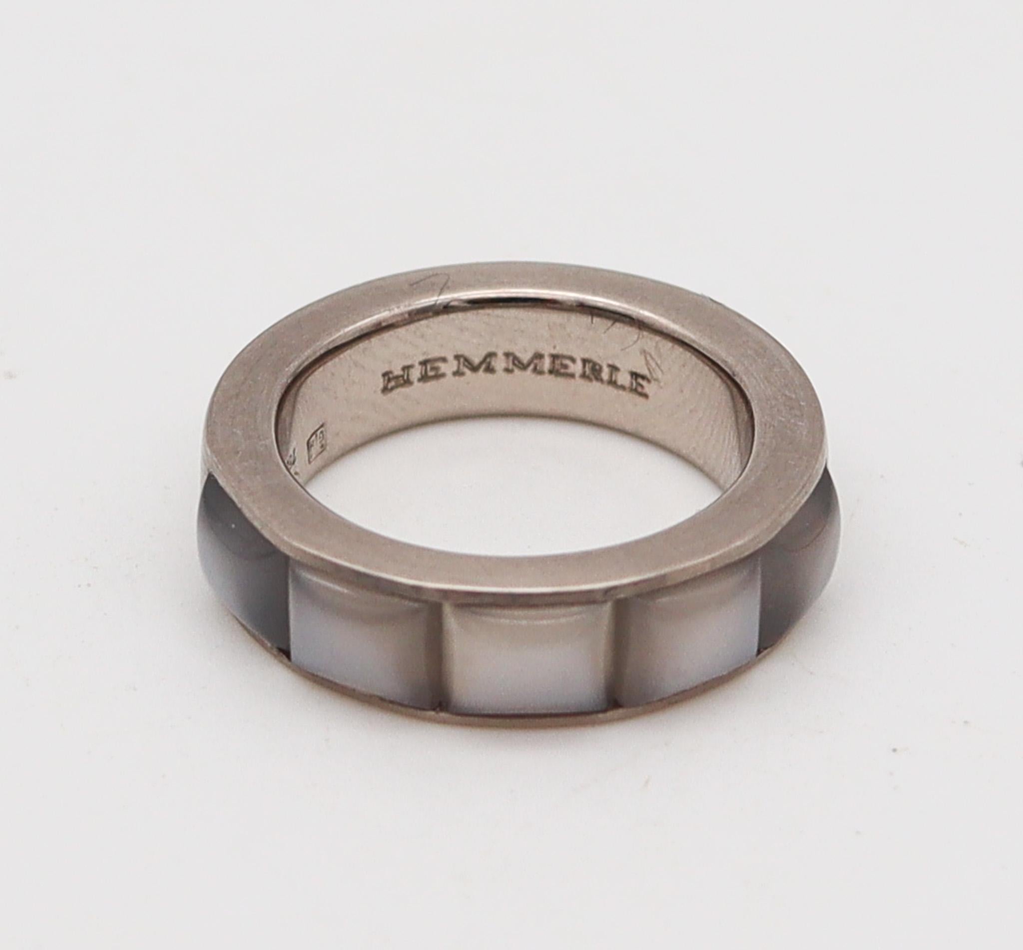 A ring band designed by Hemmerle.

Beautiful half eternity band, created in Munich Germany by the jewelry house of Hemmerle, back in the 1990's. This gorgeous ring has been carefully crafted in solid white gold of 18 karats with a delicate thin