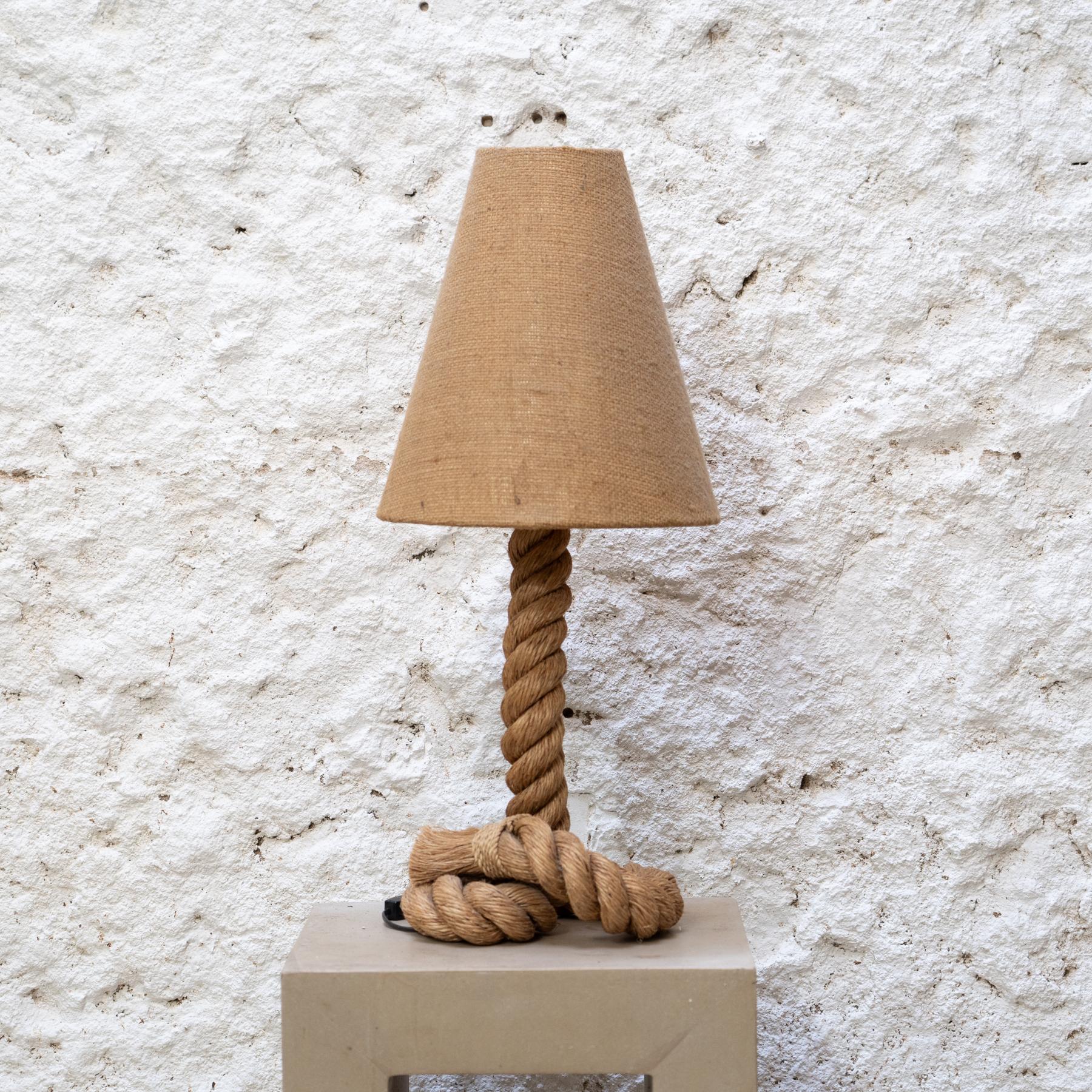 Hemp Rope Table Lamp in the Style of Audoux & Minet, Circa 1990

Manufacturer: Unknown

Style: Inspired by Audoux & Minet

Year: Circa 1990

Materials: Hemp rope, fabric

Condition: Original condition with minor wear consistent with age and use,