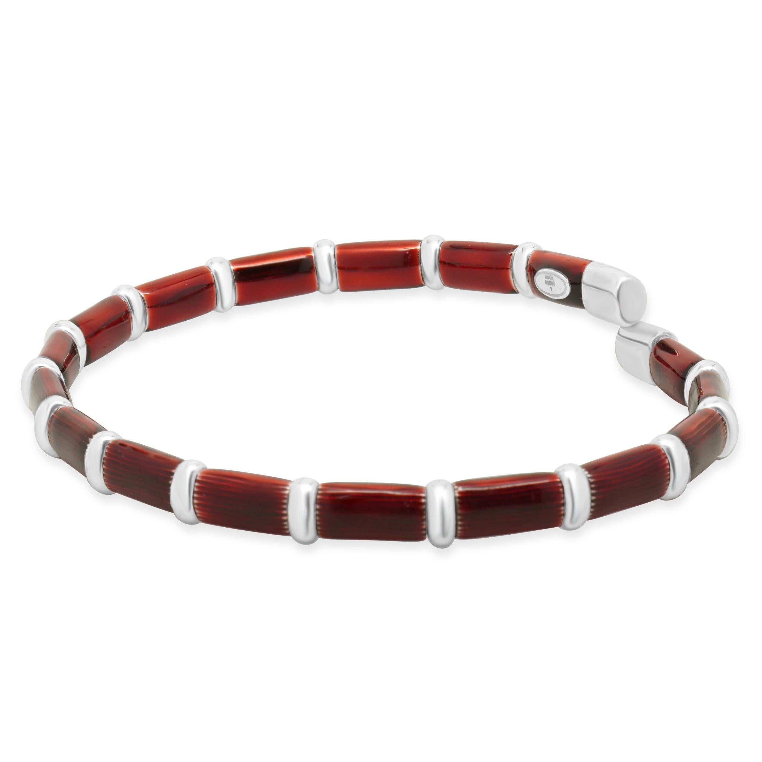 Designer: Henderson Legacy
Material: 18K white gold, sterling silver, red enamel
Dimensions: bracelet will fit a 7-inch wrist
Weight: 14.95 grams
