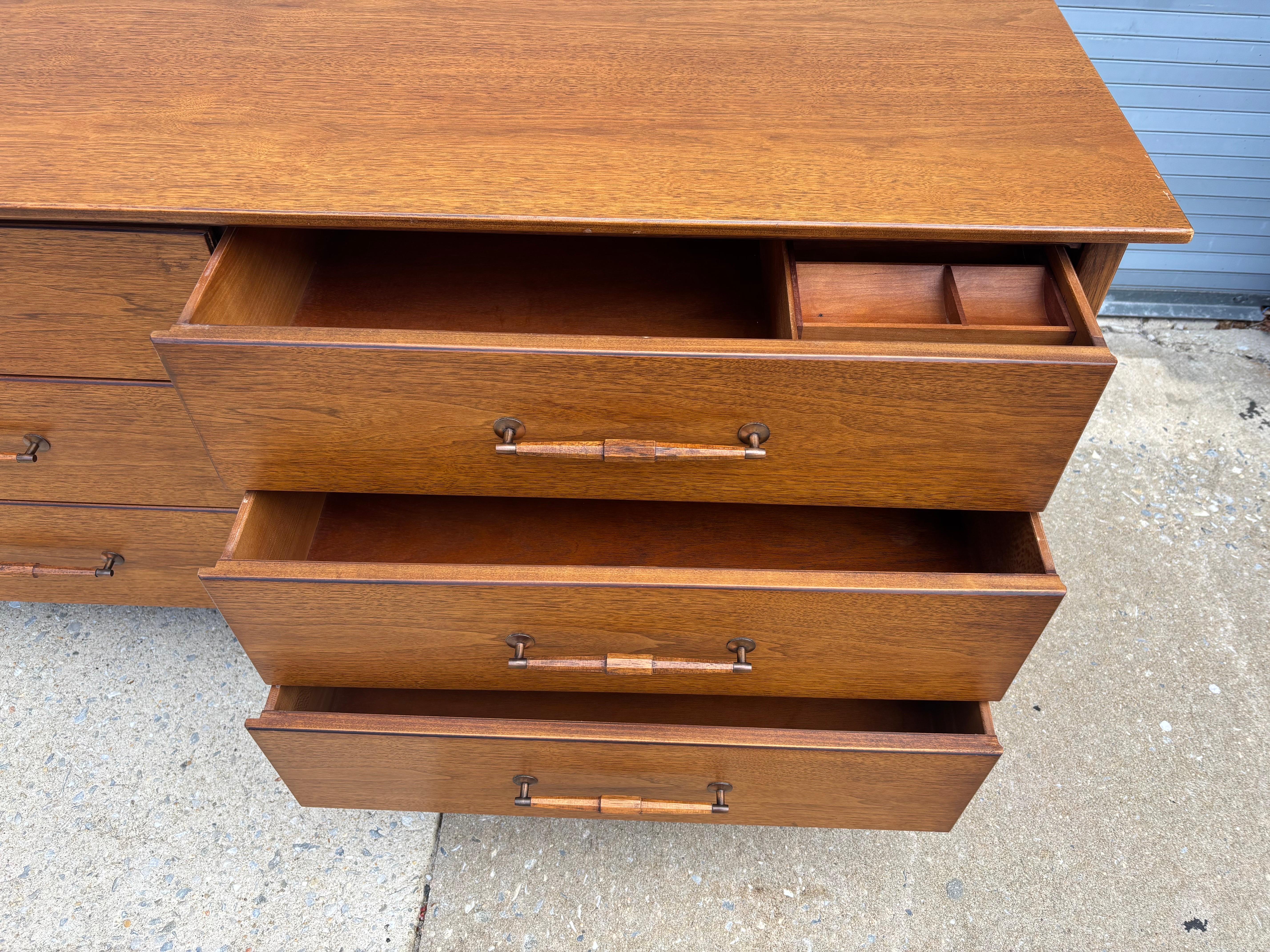 Henredon 6 Drawer Walnut Dresser in Clean Original Condition.  Matching nightstand listed in separate listing.  Unusual turned wood handles add a unique element to the look of this piece.