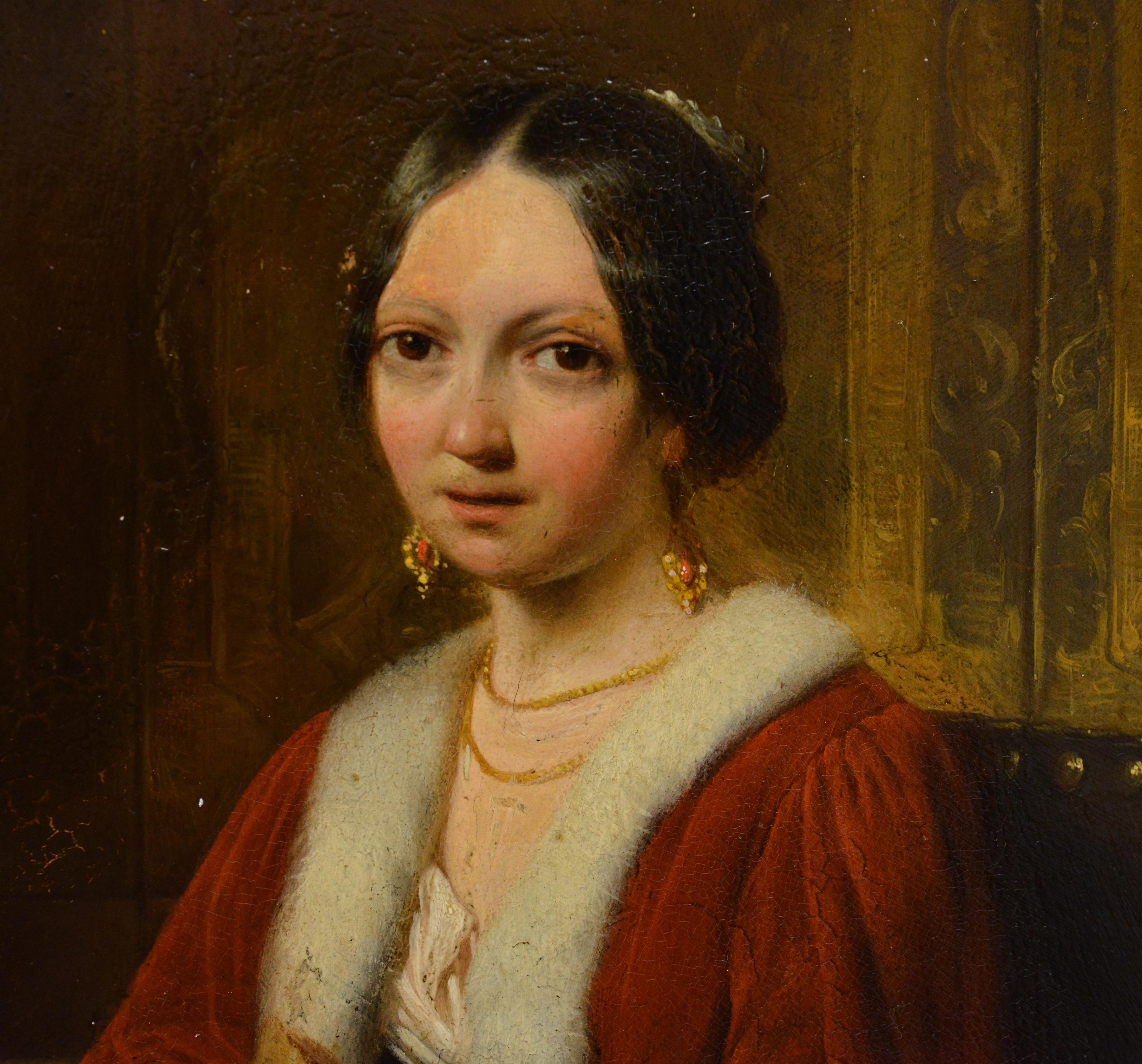 Attribué à Hendrik Hollander (1823-1884). Cet exemple exquis de peinture de genre européenne du XIXe siècle représente un couple noble en train de lire dans un intérieur luxueux. La jeune femme aristocratique, élégamment installée dans son fauteuil