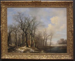 A winter landscape with hunters on a path along a stream