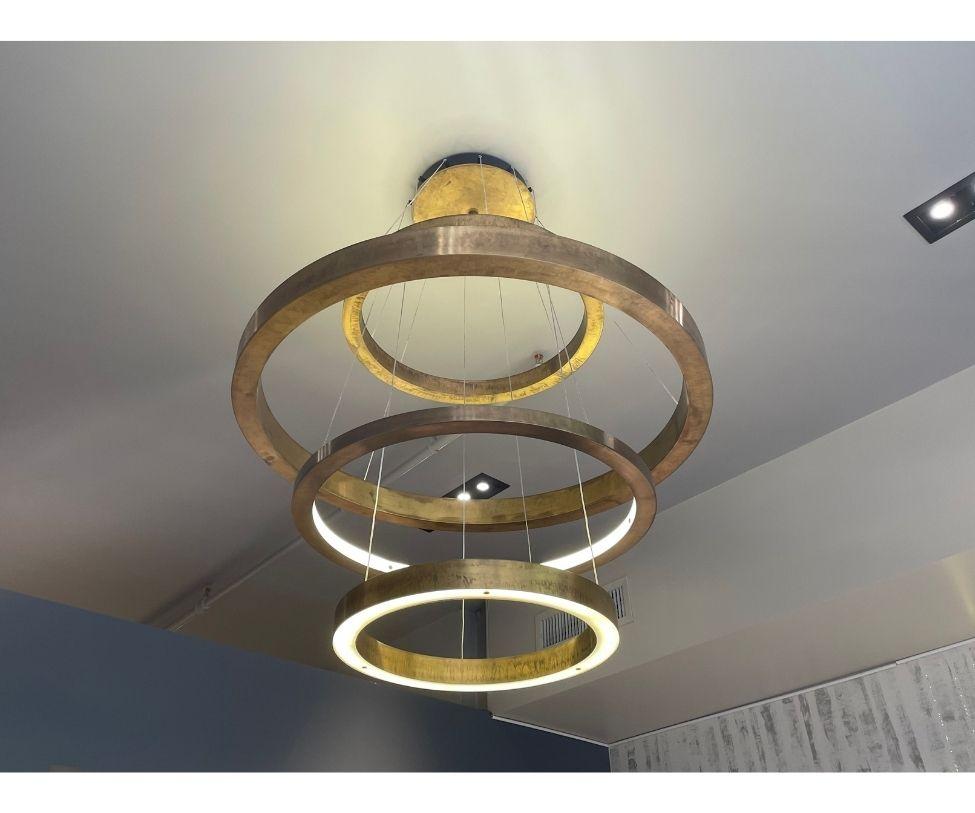 Designed By Massimo Castagna

Pendant led lamp with warm light made up of metal rings. Handmade;
transformers inserted in the ceiling rosette, rings powered with low voltage through suspension wires.
LED Color Temperature 3000K

Non-dimmable.